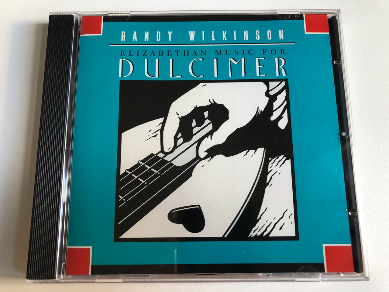 https://cdn10.bigcommerce.com/s-62bdpkt7pb/products/0/images/240623/Randy_Wilkinson_Elizabethan_Music_For_Dulcimer_Kicking_Mule_Records_Audio_CD_1997_KMCD-3907-2_1__53545.1658308980.1280.1280.JPG?c=2&_gl=1*1v7odoq*_ga*MjA2NTIxMjE2MC4xNTkwNTEyNTMy*_ga_WS2VZYPC6G*MTY1ODI5OTQ0MC40ODkuMS4xNjU4MzA4Nzk0LjQx