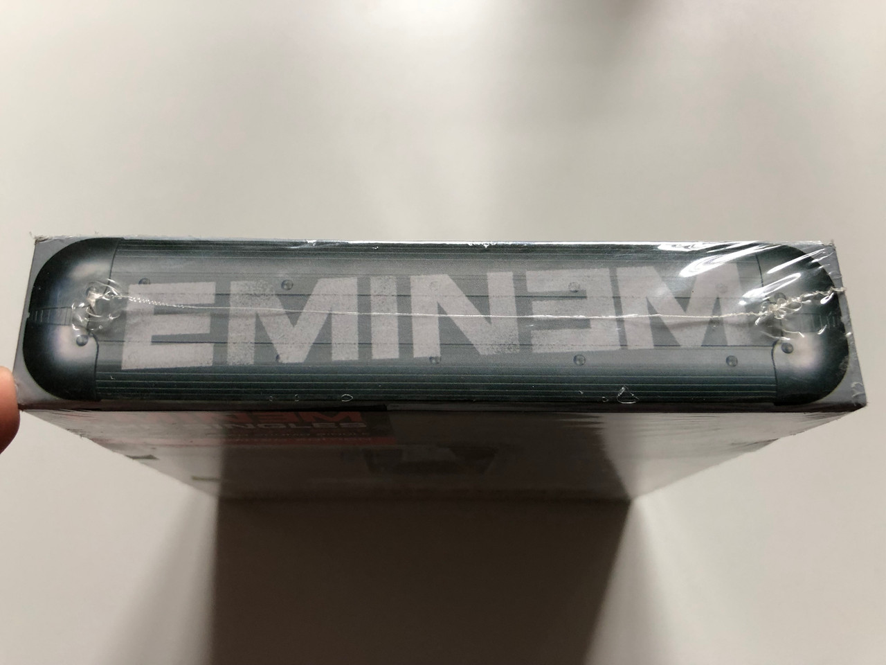 https://cdn10.bigcommerce.com/s-62bdpkt7pb/products/0/images/240731/Eminem_The_Singles_10_1_CD_Box_Set_Incl._Unreleased_Promo_Single_Aftermath_Entertainment_11x_Audio_CD_2003_Box_Set_0602498616017_3__41389.1658315020.1280.1280.JPG?c=2&_gl=1*rcet93*_ga*MjA2NTIxMjE2MC4xNTkwNTEyNTMy*_ga_WS2VZYPC6G*MTY1ODMxNDU5Ni40OTAuMS4xNjU4MzE1MDI0LjYw