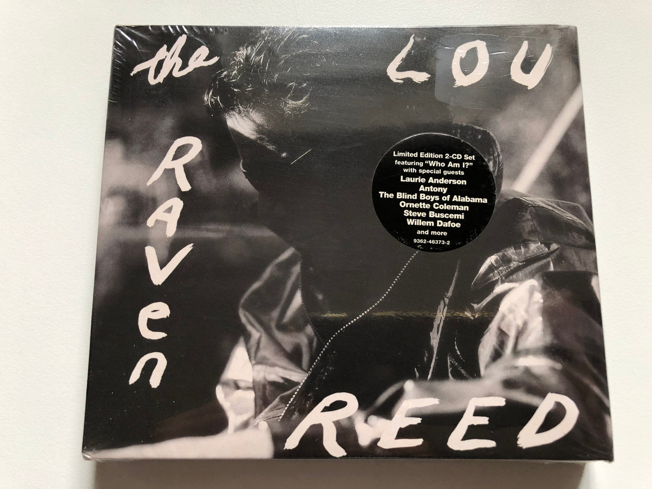 https://cdn10.bigcommerce.com/s-62bdpkt7pb/products/0/images/240747/Lou_Reed_The_Raven_Limited_Edition_2-CD_Set_featuring_Who_Am_I_with_special_guests_Laurie_Anderson_Antony_The_Blind_Boys_of_Alabama_Ornette_Coleman_Steve_Buscemi_Sire_2x_Audio_CD_1__45601.1658315815.1280.1280.JPG?c=2&_gl=1*oi1fw5*_ga*MjA2NTIxMjE2MC4xNTkwNTEyNTMy*_ga_WS2VZYPC6G*MTY1ODMxNDU5Ni40OTAuMS4xNjU4MzE1ODE4LjYw