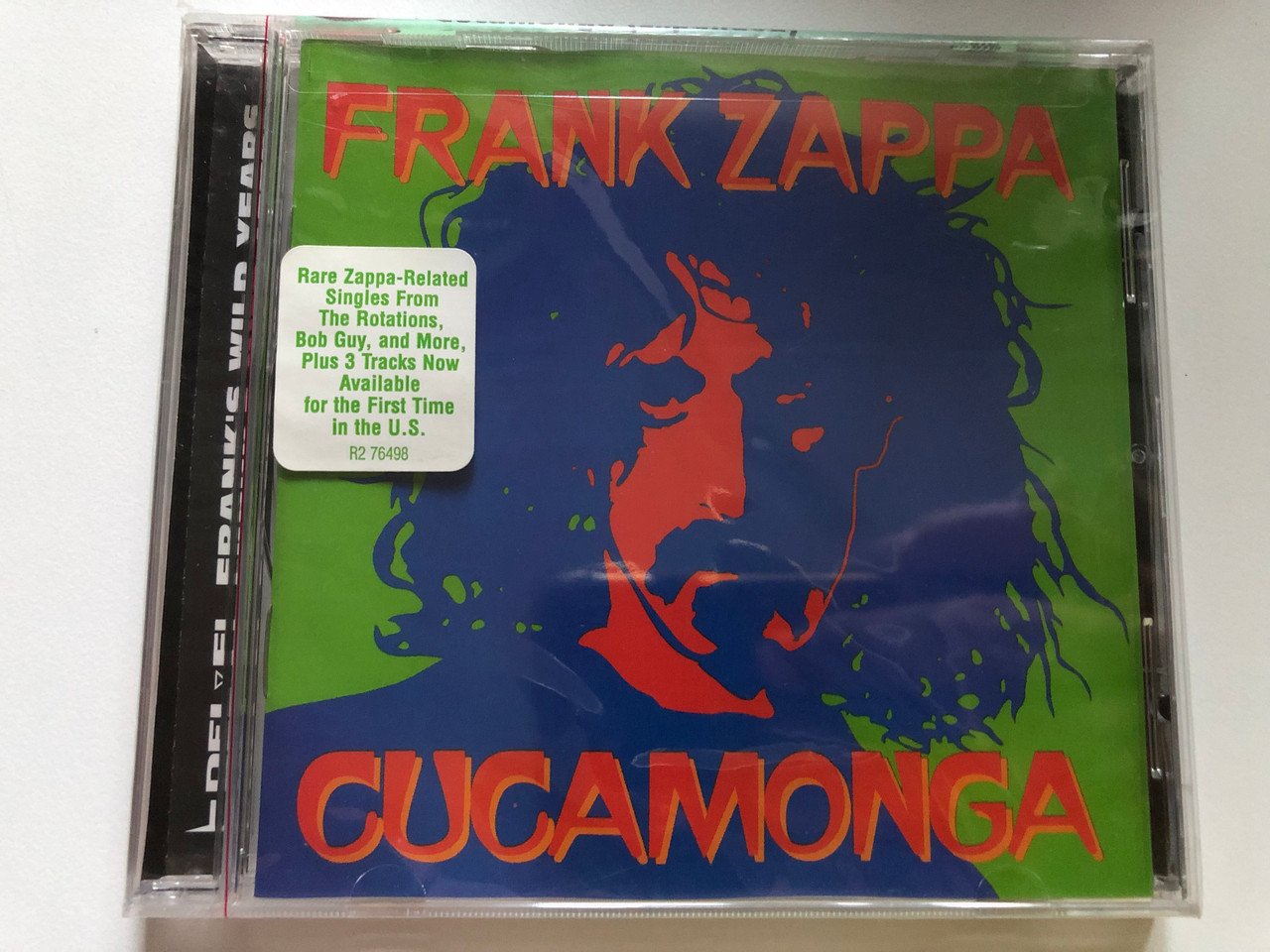 https://cdn10.bigcommerce.com/s-62bdpkt7pb/products/0/images/241204/Frank_Zappa_Cucamonga_Franks_Wild_Years_Rare_Zappa-Related_Singles_From_The_Rotations_Bob_Guy_and_More_Plus_3_Tracks_Now_Available_for_the_First_Time_in_the_U.S._Rhino_Records_Audi_1__92337.1658424891.1280.1280.JPG?c=2&_gl=1*1fo74uv*_ga*MjA2NTIxMjE2MC4xNTkwNTEyNTMy*_ga_WS2VZYPC6G*MTY1ODQxNTU2NS40OTMuMS4xNjU4NDI0NjcyLjUz