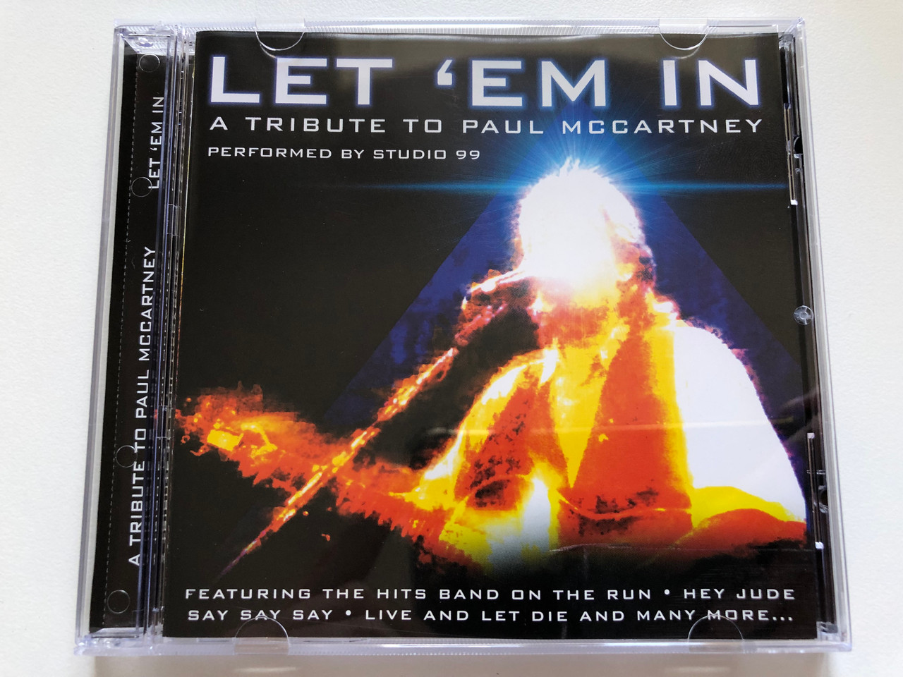 https://cdn10.bigcommerce.com/s-62bdpkt7pb/products/0/images/242659/Let_em_In_-_A_Tribute_To_Paul_McCartney_-_Performed_by_Studio_99_Featuring_The_Hits_Band_On_The_Run_Hey_Jude_Say_Say_Say_Live_And_Let_Die_And_Many_More..._Going_For_A_Song_Audio_CD_GF_1__15820.1658820287.1280.1280.JPG?c=2&_gl=1*1xemud8*_ga*MjA2NTIxMjE2MC4xNTkwNTEyNTMy*_ga_WS2VZYPC6G*MTY1ODgxMTM2Mi40OTcuMS4xNjU4ODE5OTE3LjQw