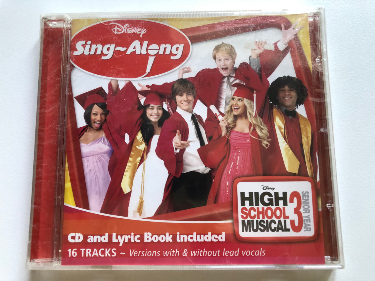 https://cdn10.bigcommerce.com/s-62bdpkt7pb/products/0/images/243954/Disney_Sing-Along_High_School_Musical_3_-_Senior_Year_CD_and_Lyric_Book_included_16_Tracks_-_Versions_with_without_lead_vocals_Walt_Disney_Records_Audio_CD_2009_695_3512_1__57091.1659088321.1280.1280.JPG?c=2&_gl=1*12v918s*_ga*MjA2NTIxMjE2MC4xNTkwNTEyNTMy*_ga_WS2VZYPC6G*MTY1OTA4NTA2NS41MDUuMS4xNjU5MDg4MTIwLjU1