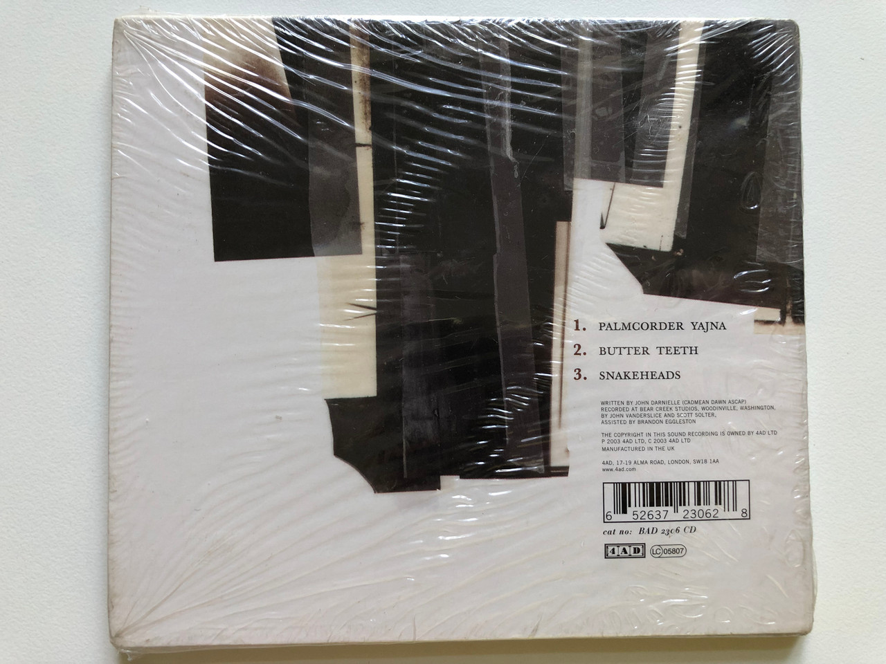 https://cdn10.bigcommerce.com/s-62bdpkt7pb/products/0/images/244364/The_Mountain_Goats_Palmcorder_Yajna_4AD_Audio_CD_2003_BAD_2306_CD_2__84823.1659372906.1280.1280.JPG?c=2&_gl=1*1473i2s*_ga*MjA2NTIxMjE2MC4xNTkwNTEyNTMy*_ga_WS2VZYPC6G*MTY1OTM2MTk0MC41MDcuMS4xNjU5MzcyOTkyLjYw