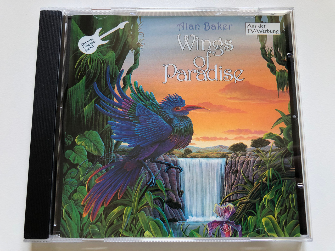 https://cdn10.bigcommerce.com/s-62bdpkt7pb/products/0/images/244783/Alan_Baker_Wings_Of_Paradise_Coconut_Audio_CD_1991_262_539_1__28361.1659446305.1280.1280.JPG?c=2&_gl=1*xror76*_ga*MjA2NTIxMjE2MC4xNTkwNTEyNTMy*_ga_WS2VZYPC6G*MTY1OTQzOTk1Mi41MDguMS4xNjU5NDQ1ODYyLjU2