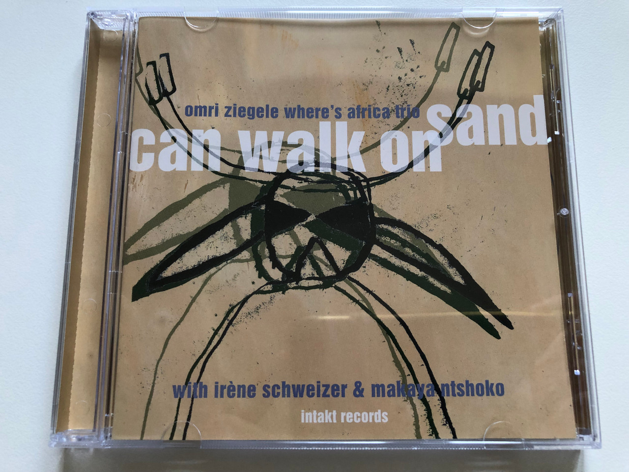 https://cdn10.bigcommerce.com/s-62bdpkt7pb/products/0/images/244904/Omri_Ziegele_Wheres_Africa_Trio_-_Can_Walk_On_Sand_-_With_Irene_Schweizer_Makaya_Ntshoko_Intakt_Records_Audio_CD_instakt_cd_167_1__94326.1659452570.1280.1280.JPG?c=2&_gl=1*x9fgwi*_ga*MjA2NTIxMjE2MC4xNTkwNTEyNTMy*_ga_WS2VZYPC6G*MTY1OTQ0OTY4OC41MDkuMS4xNjU5NDUyMjcxLjM5