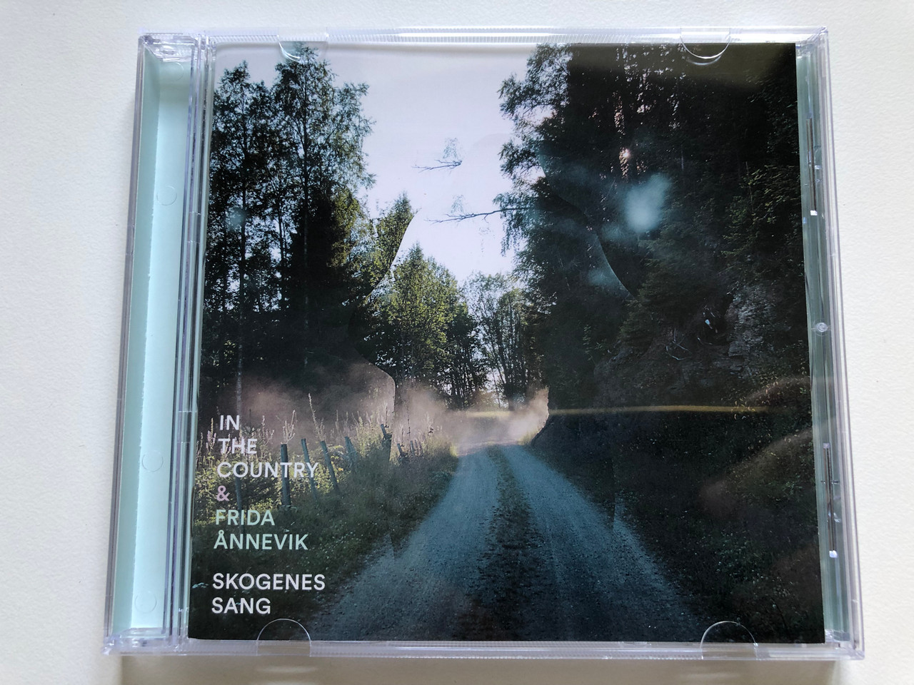https://cdn10.bigcommerce.com/s-62bdpkt7pb/products/0/images/245033/In_The_Country_Frida_nnevik_Skogenes_Sang_Grappa_Audio_CD_2014_GRCD4472_1__25091.1659461894.1280.1280.JPG?c=2&_gl=1*1ys2nr4*_ga*MjA2NTIxMjE2MC4xNTkwNTEyNTMy*_ga_WS2VZYPC6G*MTY1OTQ2MDc4Ni41MTAuMS4xNjU5NDYxNzg4LjQz