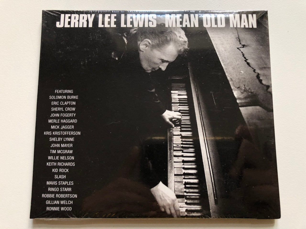 https://cdn10.bigcommerce.com/s-62bdpkt7pb/products/0/images/245383/Jerry_Lee_Lewis_Mean_Old_Man_Featuring_Solomon_Burke_Eric_Clapton_Sheryl_Crow_John_Fogerty_Merle_Haggard_Mick_Jagger_Kris_Kristoferson_Shelby_Lynne_John_Mayer_Tim_Mcgraw_Willie_1__77902.1659543280.1280.1280.JPG?c=2&_gl=1*18z473o*_ga*MjA2NTIxMjE2MC4xNTkwNTEyNTMy*_ga_WS2VZYPC6G*MTY1OTU0MTQzMS41MTIuMS4xNjU5NTQyOTE4LjM3