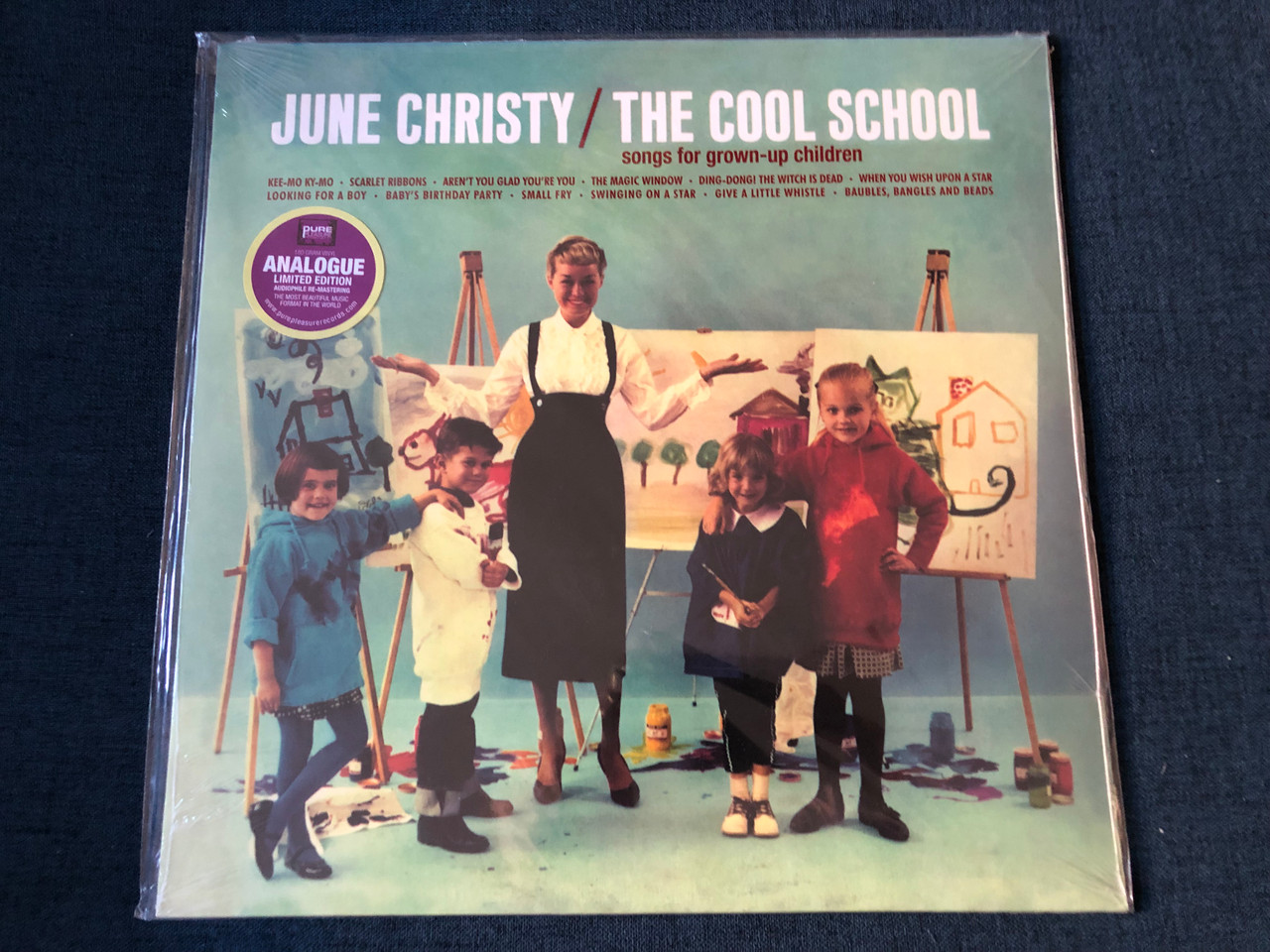 https://cdn10.bigcommerce.com/s-62bdpkt7pb/products/0/images/246152/June_Christy_The_Cool_School_Songs_For_Grown-up_Children_Kee-Mo_Ky-Mo_Scarlet_Ribbons_Arent_You_Glad_Youre_You_The_Magic_Window_Ding-Dong_The_Witch_Is_Dead_When_You_Wish_Upon_A_Sta_1__64496.1659685813.1280.1280.JPG?c=2&_gl=1*agr3is*_ga*MjA2NTIxMjE2MC4xNTkwNTEyNTMy*_ga_WS2VZYPC6G*MTY1OTY4MTMzNy41MTYuMS4xNjU5Njg1NDI2LjQy