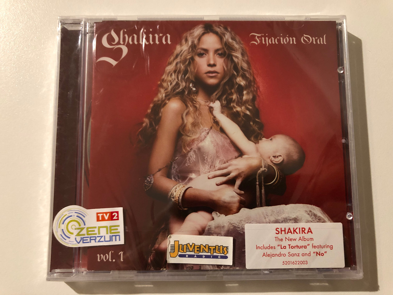 https://cdn10.bigcommerce.com/s-62bdpkt7pb/products/0/images/247369/Shakira_Fijacin_Oral_Vol._1_Includes_La_Tortura_featuring_Alejandro_Sanz_and_No_Epic_Audio_CD_2005_EPC_520162_2_1__69940.1660113048.1280.1280.JPG?c=2&_gl=1*1oob96h*_ga*MjA2NTIxMjE2MC4xNTkwNTEyNTMy*_ga_WS2VZYPC6G*MTY2MDEwMTI3OS41MjMuMS4xNjYwMTEyODMzLjU4