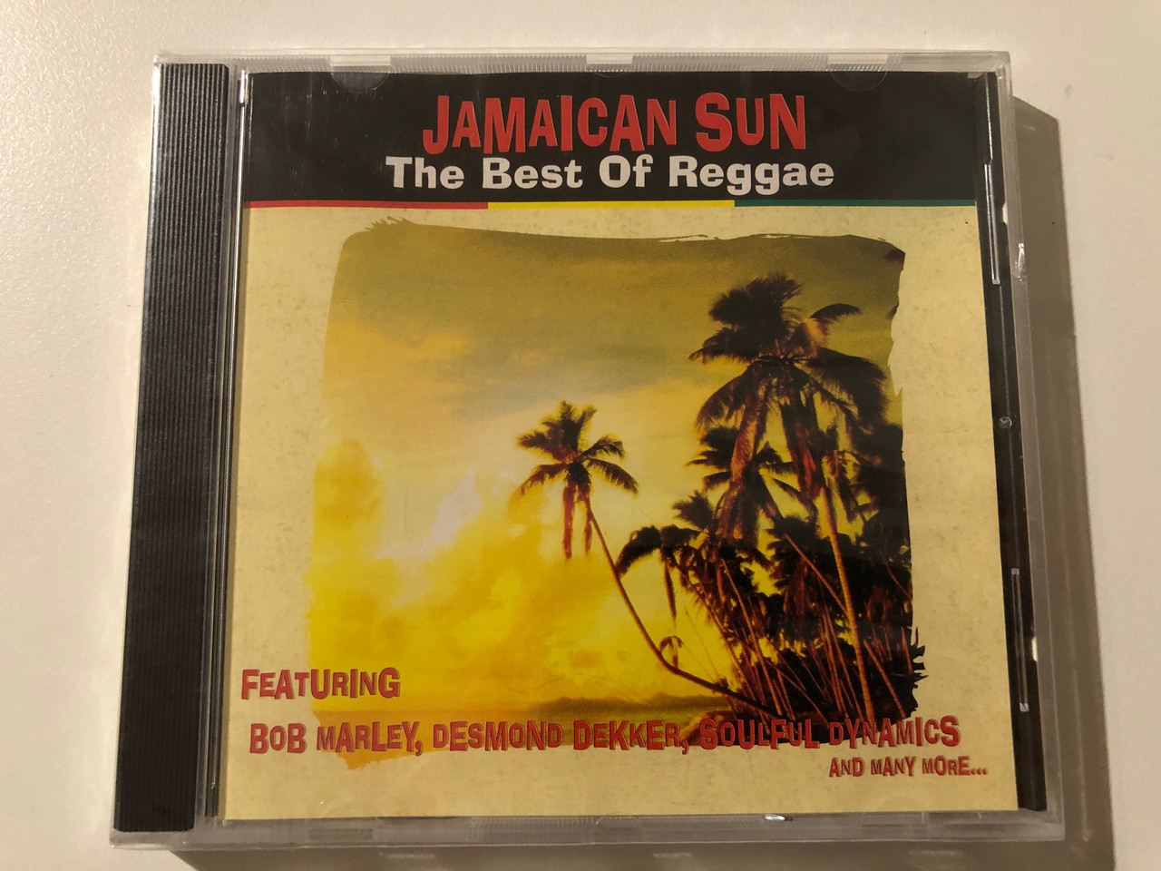 https://cdn10.bigcommerce.com/s-62bdpkt7pb/products/0/images/247382/Jamaican_Sun_-_The_Best_Of_Reggae_Featuring_Bob_Marley_Desmond_Dekker_Soulful_Dynamics_and_many_more..._FMCG_Audio_CD_1997_FMC068_1__10191.1660114978.1280.1280.JPG?c=2&_gl=1*1lzoqtn*_ga*MjA2NTIxMjE2MC4xNTkwNTEyNTMy*_ga_WS2VZYPC6G*MTY2MDEwMTI3OS41MjMuMS4xNjYwMTE0ODEwLjU5