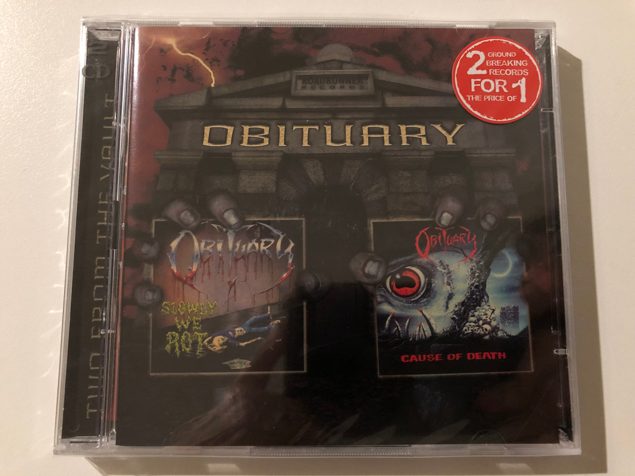 https://cdn10.bigcommerce.com/s-62bdpkt7pb/products/0/images/247608/Obituary_Slowly_We_Rot_Cause_Of_Death_Two_From_The_Vault_Roadrunner_Records_2x_Audio_CD_2003_RR_8360-2_1__98905.1660213158.1280.1280.JPG?c=2&_gl=1*1uzrzbj*_ga*MjA2NTIxMjE2MC4xNTkwNTEyNTMy*_ga_WS2VZYPC6G*MTY2MDE5OTQ4NC41MjQuMS4xNjYwMjEzMTMwLjYw