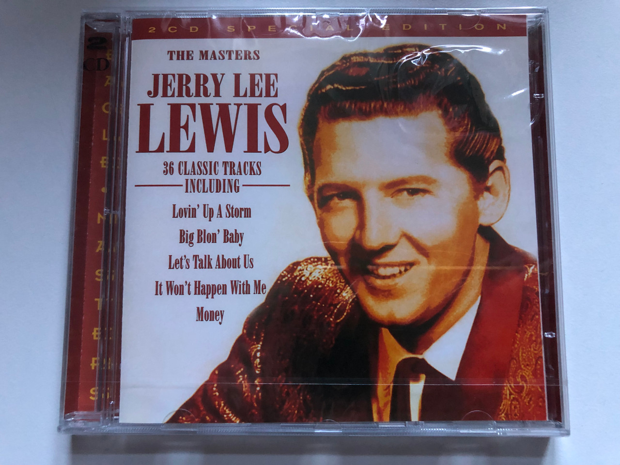 https://cdn10.bigcommerce.com/s-62bdpkt7pb/products/0/images/248771/Jerry_Lee_Lewis_The_Masters_36_Classic_Tracks_Including_Lovin_Up_A_Storm_Big_Blon_Baby_Lets_Talk_About_Us_It_Wont_Happen_With_Me_Money_Eagle_Records_2x_Audio_CD_1997_EDM_CD_014_1__52460.1660747454.1280.1280.JPG?c=2&_gl=1*lvq85g*_ga*MjA2NTIxMjE2MC4xNTkwNTEyNTMy*_ga_WS2VZYPC6G*MTY2MDc0NjA3MS41MzAuMS4xNjYwNzQ3MDQ4LjMxLjAuMA..