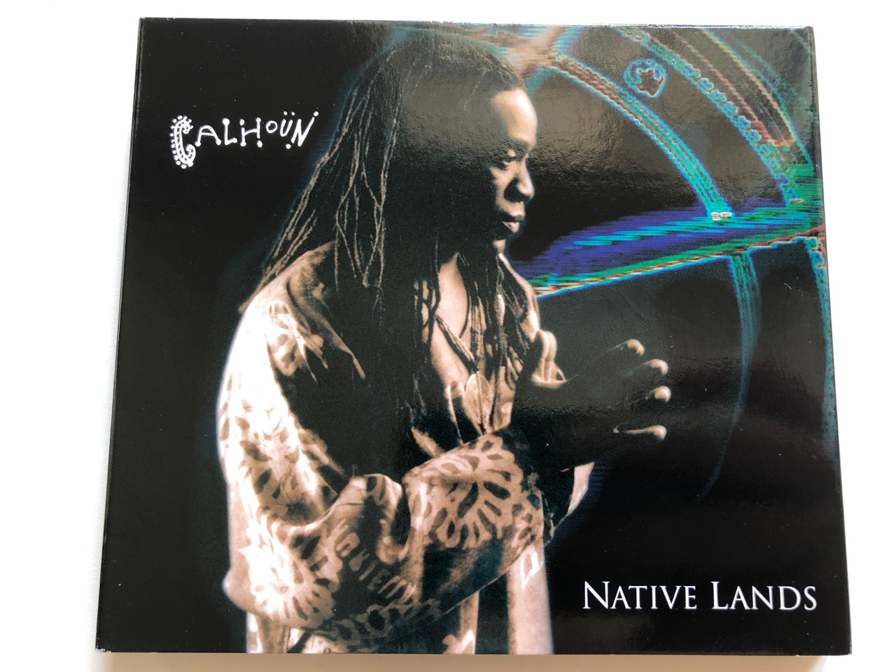 https://cdn10.bigcommerce.com/s-62bdpkt7pb/products/0/images/248829/Calhoun_Native_Lands_Enja_Records_Audio_CD_DVD_CD_9168-2_1__40021.1660756315.1280.1280.JPG?c=2&_gl=1*1ai7qht*_ga*MjA2NTIxMjE2MC4xNTkwNTEyNTMy*_ga_WS2VZYPC6G*MTY2MDc0NjA3MS41MzAuMS4xNjYwNzU1OTgyLjYwLjAuMA..