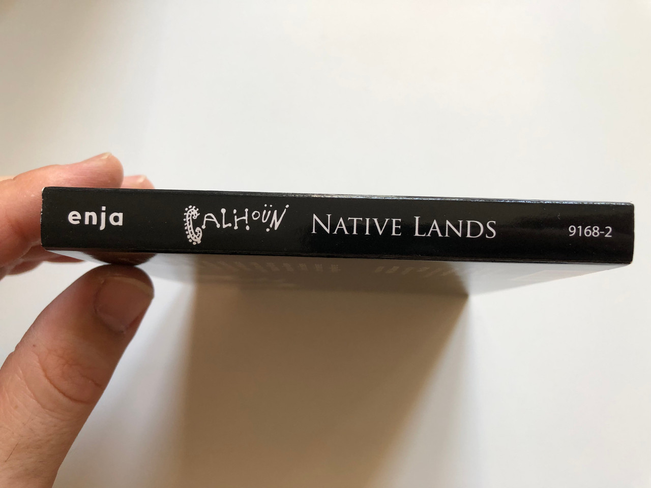https://cdn10.bigcommerce.com/s-62bdpkt7pb/products/0/images/248831/Calhoun_Native_Lands_Enja_Records_Audio_CD_DVD_CD_9168-2_3__38955.1660756318.1280.1280.JPG?c=2&_gl=1*1ai7qht*_ga*MjA2NTIxMjE2MC4xNTkwNTEyNTMy*_ga_WS2VZYPC6G*MTY2MDc0NjA3MS41MzAuMS4xNjYwNzU1OTgyLjYwLjAuMA..