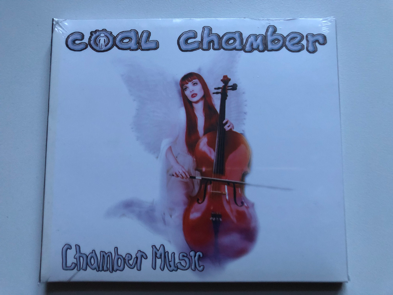 https://cdn10.bigcommerce.com/s-62bdpkt7pb/products/0/images/249128/Coal_Chamber_Chamber_Music_Roadrunner_Records_Audio_CD_1999_RR_8659-5_1__33402.1660828155.1280.1280.JPG?c=2&_gl=1*9rmada*_ga*MjA2NTIxMjE2MC4xNTkwNTEyNTMy*_ga_WS2VZYPC6G*MTY2MDgyNjg1NS41MzEuMC4xNjYwODI2ODU1LjYwLjAuMA..