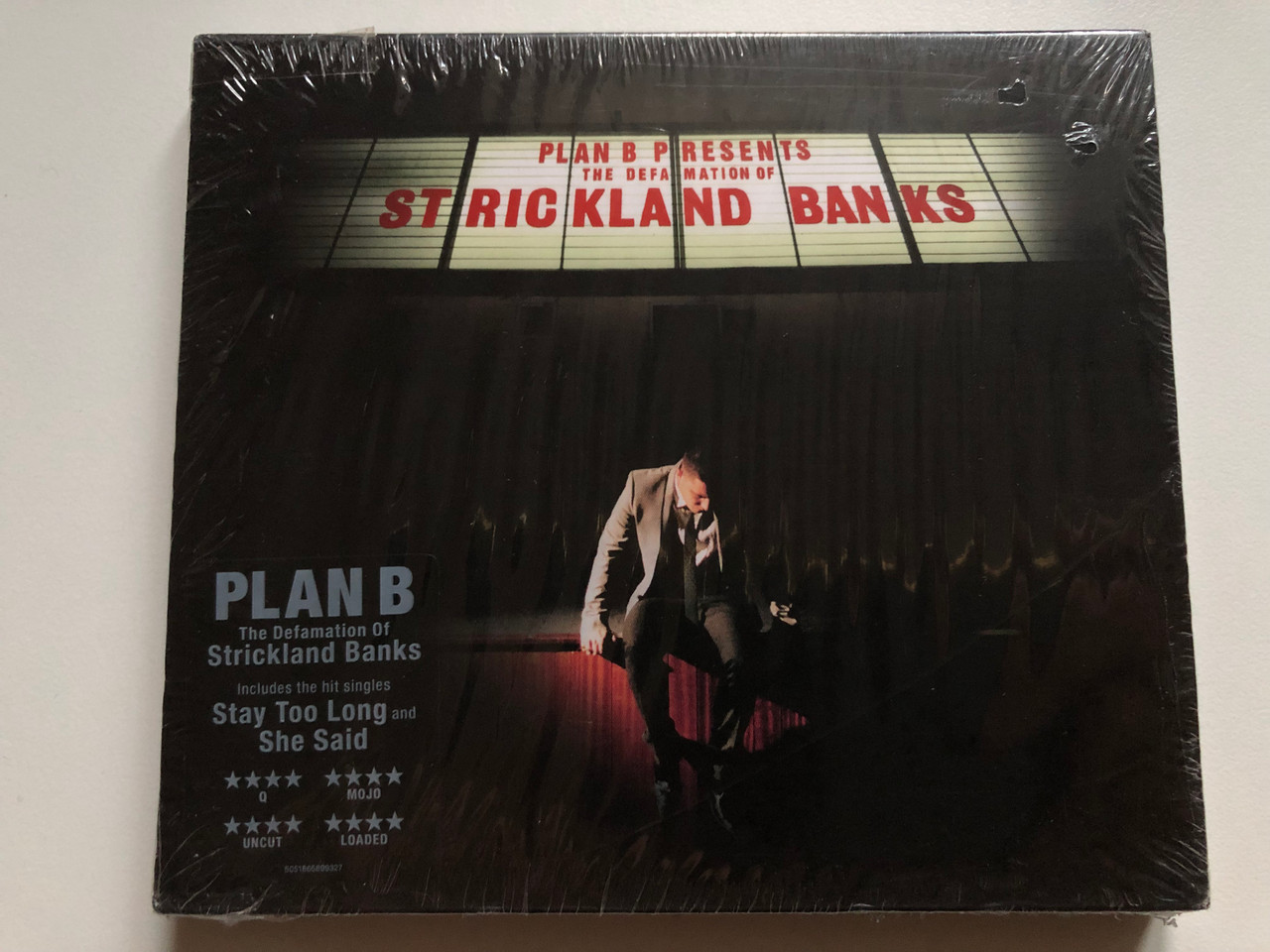 https://cdn10.bigcommerce.com/s-62bdpkt7pb/products/0/images/249441/Plan_B_Presents_The_Defamation_Of_Strickland_Banks_Includes_the_hit_singles_Stay_Too_Long_and_She_Said_Atlantic_2x_Audio_CD_2010_5051865899327_1__60369.1660921338.1280.1280.JPG?c=2&_gl=1*129c8n4*_ga*MjA2NTIxMjE2MC4xNTkwNTEyNTMy*_ga_WS2VZYPC6G*MTY2MDkxNjg4My41MzIuMS4xNjYwOTIwODk3LjQ5LjAuMA..