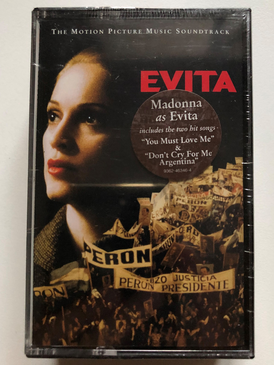 https://cdn10.bigcommerce.com/s-62bdpkt7pb/products/0/images/249461/Evita_The_Motion_Picture_Music_Soundtrack_Madonna_as_Evita_includes_the_two_hit_songs_You_Must_Love_Me_Dont_Cry_For_Me_Argentina_Warner_Bros._Records_2x_Cassette_9362-46346-4_1__02408.1660926066.1280.1280.JPG?c=2&_gl=1*1xf1g7v*_ga*MjA2NTIxMjE2MC4xNTkwNTEyNTMy*_ga_WS2VZYPC6G*MTY2MDkxNjg4My41MzIuMS4xNjYwOTI2MDc5LjIzLjAuMA..