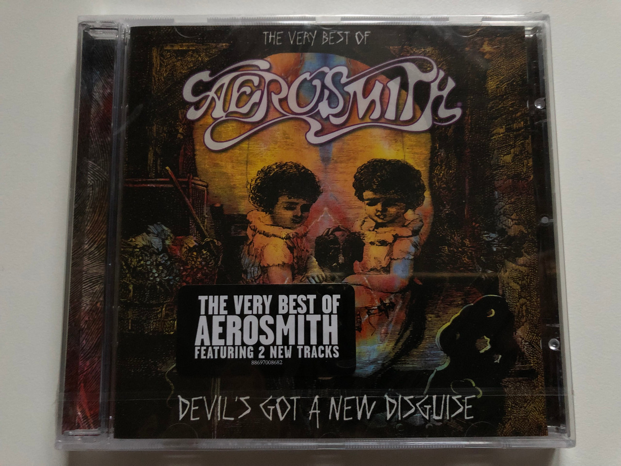 https://cdn10.bigcommerce.com/s-62bdpkt7pb/products/0/images/250015/Aerosmith_Devils_Got_A_New_Disguise_The_Very_Best_Of_Aerosmith_Featuring_2_New_Tracks_Columbia_Audio_CD_2006_88697_00868_2_1__08450.1661161840.1280.1280.JPG?c=2&_gl=1*lucfdh*_ga*MjA2NTIxMjE2MC4xNTkwNTEyNTMy*_ga_WS2VZYPC6G*MTY2MTE1MDA1NS41MzMuMS4xNjYxMTYxNjg2LjM1LjAuMA..