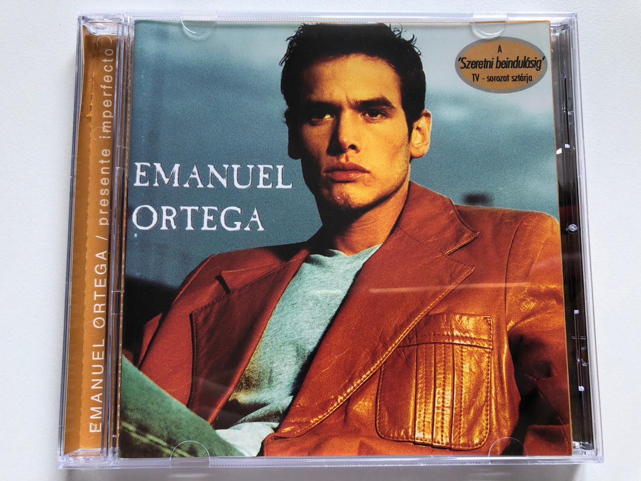 https://cdn10.bigcommerce.com/s-62bdpkt7pb/products/0/images/251006/Emanuel_Ortega_Presente_Imperfecto_Melody_Latina_Audio_CD_2001_7_43219_28512_1__94108.1661325338.1280.1280.JPG?c=2&_gl=1*yvd4yc*_ga*MjA2NTIxMjE2MC4xNTkwNTEyNTMy*_ga_WS2VZYPC6G*MTY2MTMxOTg5Ni41MzYuMS4xNjYxMzI1MjExLjMxLjAuMA..