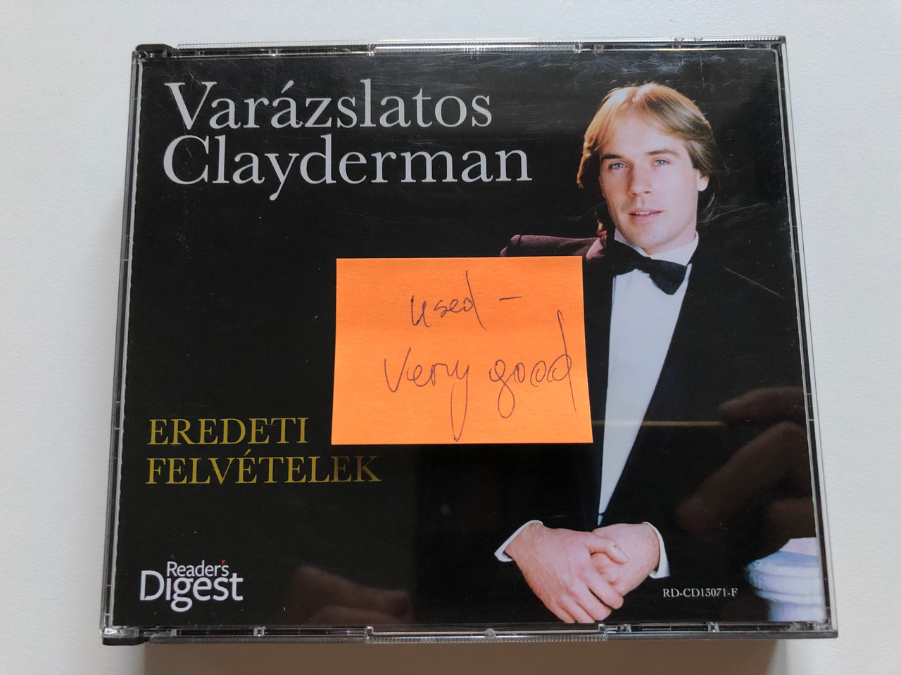 https://cdn10.bigcommerce.com/s-62bdpkt7pb/products/0/images/252732/Varzslatos_Clayderman_-_Eredeti_Felvetelek_Readers_Digest_5x_Audio_CD_2013_RD-CD13071-1-5_19__34122.1661792395.1280.1280.JPG?c=2&_gl=1*1rado4*_ga*MjA2NTIxMjE2MC4xNTkwNTEyNTMy*_ga_WS2VZYPC6G*MTY2MTc4MjI5Ny41NDEuMS4xNjYxNzkyMzM5LjYwLjAuMA..