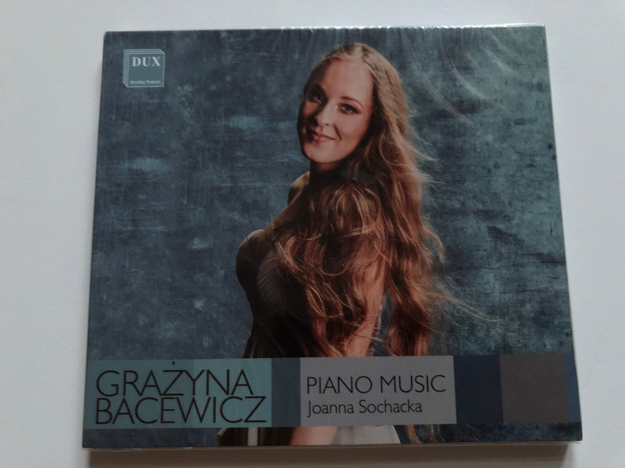 https://cdn10.bigcommerce.com/s-62bdpkt7pb/products/0/images/252763/Grazyna_Bacewicz_-_Piano_Music_-_Joanna_Sochacka_DUX_Recording_Producers_Audio_CD_2021_DUX_1689_1__15763.1661798359.1280.1280.JPG?c=2&_gl=1*6ss6pc*_ga*MjA2NTIxMjE2MC4xNTkwNTEyNTMy*_ga_WS2VZYPC6G*MTY2MTc4MjI5Ny41NDEuMS4xNjYxNzk4MjQ4LjUwLjAuMA..