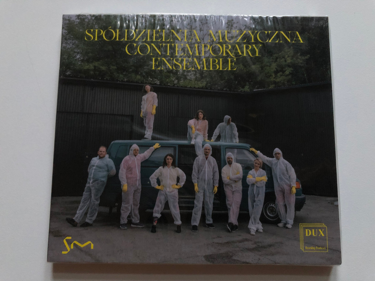 https://cdn10.bigcommerce.com/s-62bdpkt7pb/products/0/images/252816/Spdzielnia_Muzyczna_Contemporary_Ensemble_DUX_Recording_Producers_Audio_CD_2021_DUX_1698_1__36579.1661864962.1280.1280.JPG?c=2&_gl=1*1f39drh*_ga*MjA2NTIxMjE2MC4xNTkwNTEyNTMy*_ga_WS2VZYPC6G*MTY2MTg2MzUzNi41NDIuMS4xNjYxODY1MDUzLjYwLjAuMA..
