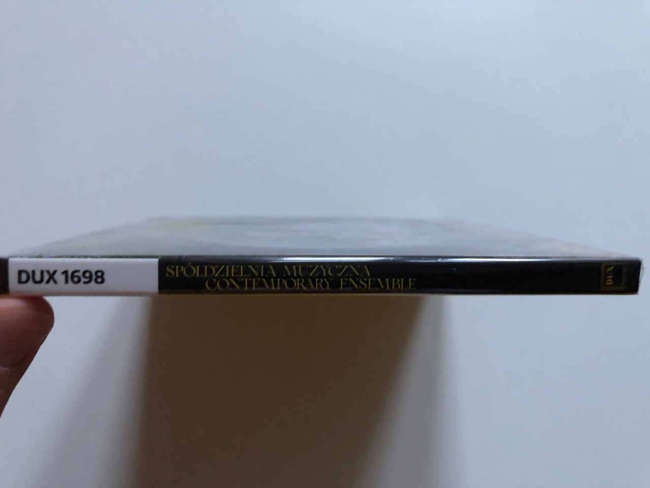 https://cdn10.bigcommerce.com/s-62bdpkt7pb/products/0/images/252818/Spdzielnia_Muzyczna_Contemporary_Ensemble_DUX_Recording_Producers_Audio_CD_2021_DUX_1698_3__89538.1661865080.1280.1280.JPG?c=2&_gl=1*1f39drh*_ga*MjA2NTIxMjE2MC4xNTkwNTEyNTMy*_ga_WS2VZYPC6G*MTY2MTg2MzUzNi41NDIuMS4xNjYxODY1MDUzLjYwLjAuMA..