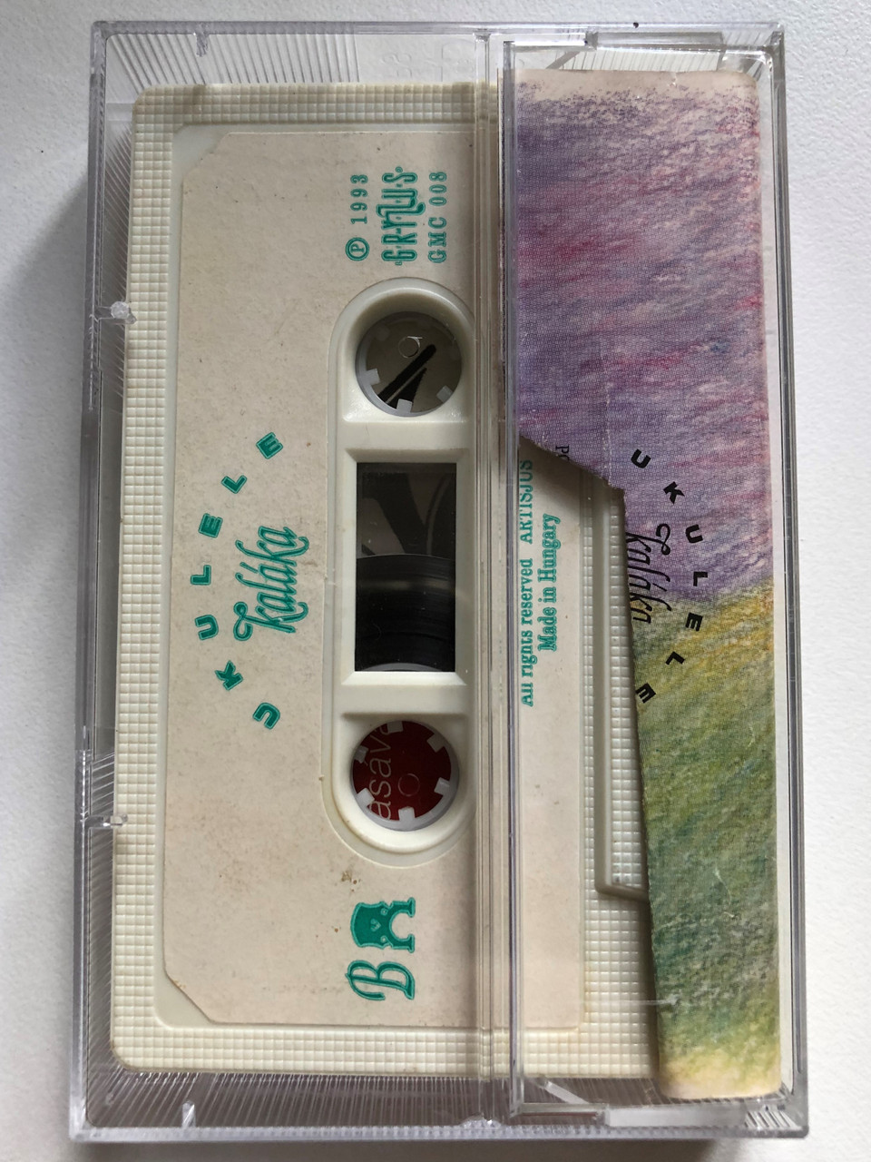 https://cdn10.bigcommerce.com/s-62bdpkt7pb/products/0/images/252912/Kalka_Ukulele_Gryllus_Audio_Cassette_1993_GMC_008_2__59617.1661957991.1280.1280.JPG?c=2&_gl=1*a6ja4i*_ga*MjA2NTIxMjE2MC4xNTkwNTEyNTMy*_ga_WS2VZYPC6G*MTY2MTk1NzAwOS41NDMuMS4xNjYxOTU3OTk2LjYwLjAuMA..