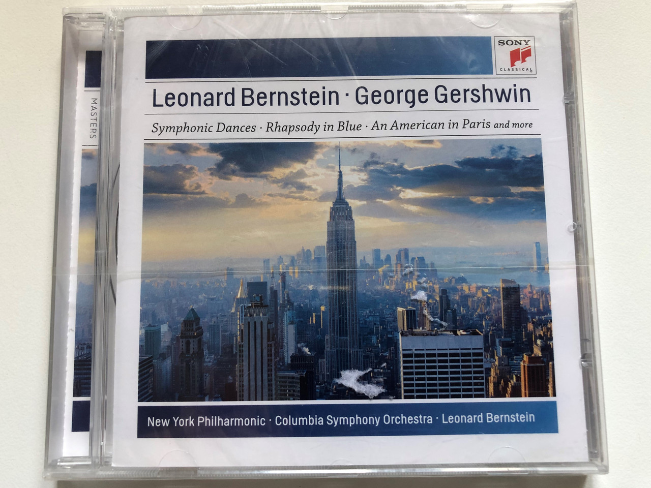 https://cdn10.bigcommerce.com/s-62bdpkt7pb/products/0/images/252976/Leonard_Bernstein_George_Gershwin_Symphonic_Dances_Rhapsody_In_Blue_An_American_In_Paris_And_More_New_York_Philharmonic_Columbia_Symphony_Orchestra_Leonard_Bernstein_Sony_Classical_A_1__28465.1661965417.1280.1280.JPG?c=2&_gl=1*58ylx1*_ga*MjA2NTIxMjE2MC4xNTkwNTEyNTMy*_ga_WS2VZYPC6G*MTY2MTk1NzAwOS41NDMuMS4xNjYxOTY1MjYzLjIwLjAuMA..