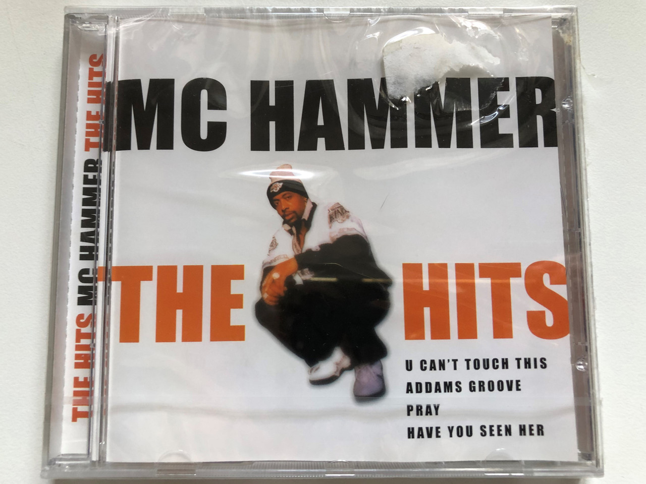 https://cdn10.bigcommerce.com/s-62bdpkt7pb/products/0/images/252990/Mc_Hammer_-_The_Hits_U_Cant_Touch_This_Addams_Groove_Pray_Have_You_Seen_Her_Disky_Audio_CD_2000_SI_997922_1__38187.1661968869.1280.1280.JPG?c=2&_gl=1*1jwthfy*_ga*MjA2NTIxMjE2MC4xNTkwNTEyNTMy*_ga_WS2VZYPC6G*MTY2MTk1NzAwOS41NDMuMS4xNjYxOTY4Njg4LjUzLjAuMA..