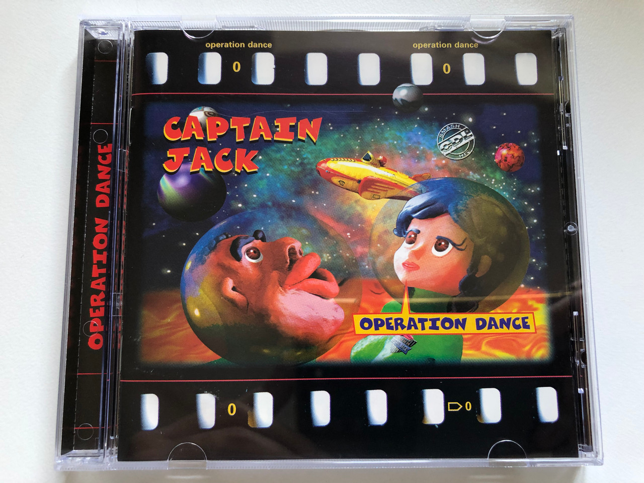 https://cdn10.bigcommerce.com/s-62bdpkt7pb/products/0/images/254012/Captain_Jack_Operation_Dance_CDL_-_Cologne_Dance_Label_Audio_CD_1997_724385637322_1__06615.1663778800.1280.1280.JPG?c=2&_gl=1*s0a3yq*_ga*MjA2NTIxMjE2MC4xNTkwNTEyNTMy*_ga_WS2VZYPC6G*MTY2Mzc3NzM1OC41NTYuMS4xNjYzNzc4NzAwLjQ4LjAuMA..