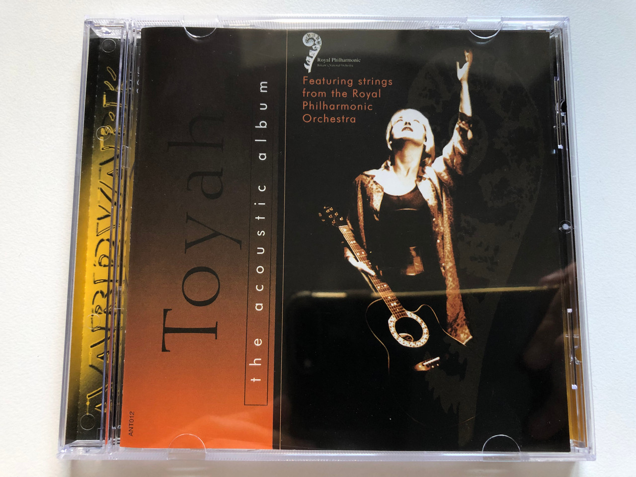 https://cdn10.bigcommerce.com/s-62bdpkt7pb/products/0/images/254130/Toyah_The_Acoustic_Album_Featuring_strings_from_the_Royal_Philharmonic_Orchestra_Aardvark_Audio_CD_1996_ANT012_1__21046.1663838504.1280.1280.JPG?c=2&_gl=1*1hhbj8j*_ga*MjA2NTIxMjE2MC4xNTkwNTEyNTMy*_ga_WS2VZYPC6G*MTY2MzgyNjg3OC41NTcuMS4xNjYzODM4MzE1LjU1LjAuMA..
