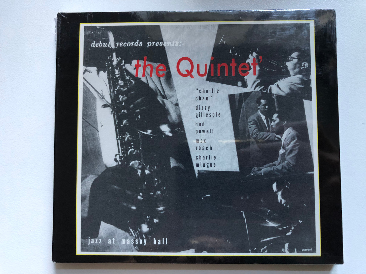 https://cdn10.bigcommerce.com/s-62bdpkt7pb/products/0/images/254486/Debut_Records_Presents_The_Quintet_Jazz_At_Massey_Hall_Charlie_Chan_Dizzy_Gillespie_Bud_Powell_Max_Roach_Charlie_Mingus_Original_Jazz_Classics_Audio_CD_OJC20_044-2_1__21970.1664205033.1280.1280.JPG?c=2&_gl=1*1dv76kg*_ga*MjA2NTIxMjE2MC4xNTkwNTEyNTMy*_ga_WS2VZYPC6G*MTY2NDIwMzQyMi41NjQuMS4xNjY0MjA0NzA4LjQ3LjAuMA..