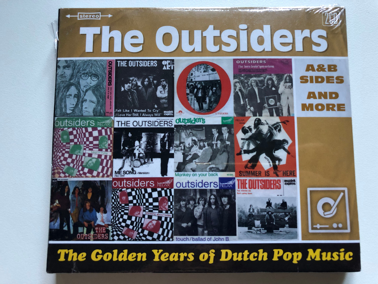 https://cdn10.bigcommerce.com/s-62bdpkt7pb/products/0/images/254557/The_Outsiders_The_Golden_Years_Of_Dutch_Pop_Music_AB_Sides_And_More_Universal_2x_Audio_CD_Stereo_2014_379_450-5_1__72574.1664213158.1280.1280.JPG?c=2&_gl=1*1fcn359*_ga*MjA2NTIxMjE2MC4xNTkwNTEyNTMy*_ga_WS2VZYPC6G*MTY2NDIxMTMzMS41NjUuMS4xNjY0MjEyOTIxLjM3LjAuMA..