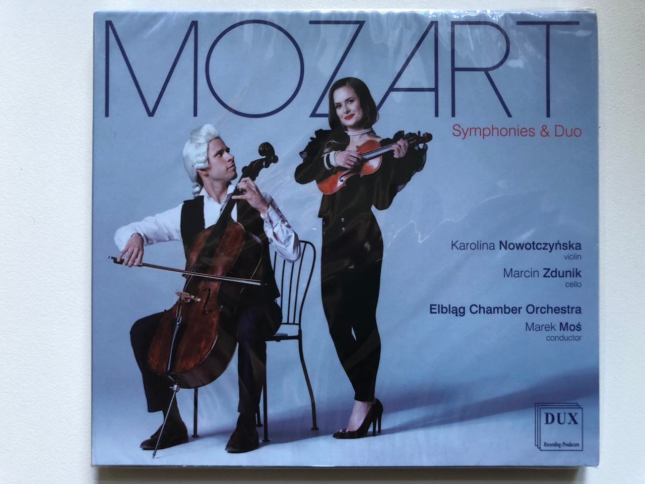 https://cdn10.bigcommerce.com/s-62bdpkt7pb/products/0/images/254999/Mozart_-_Symphonies_Duo_Karolina_Nowotczynska_violin_Marcin_Zdunik_cello_Elblag_Chamber_Orchestra_Marek_Mos_conductor_DUX_Recording_Audio_CD_2021_DUX_1690_1__76235.1664438831.1280.1280.JPG?c=2&_gl=1*1eo9ie5*_ga*MjA2NTIxMjE2MC4xNTkwNTEyNTMy*_ga_WS2VZYPC6G*MTY2NDQzNTUwNy41NzMuMS4xNjY0NDM4NzAxLjU4LjAuMA..