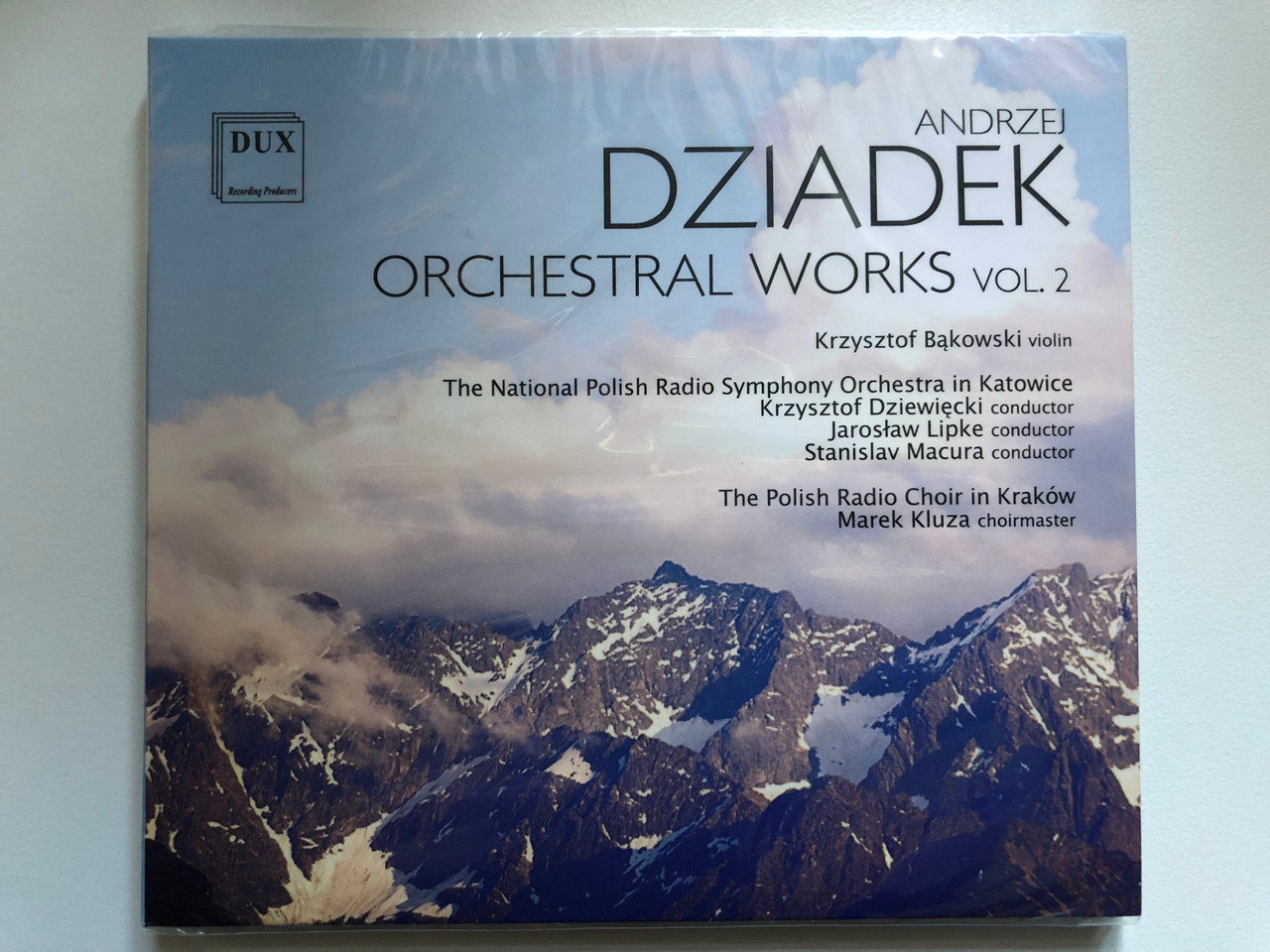 https://cdn10.bigcommerce.com/s-62bdpkt7pb/products/0/images/255028/Andrzej_Dziadek_-_Orchestral_Works_Vol._2_Krzysztof_Bakowski_violin_The_National_Polish_Radio_Symphony_Orchestra_in_Katowice_Krzysztof_Dziewiecki_conductor_Jaroslaw_Lipke_conductor_1__77717.1664444630.1280.1280.JPG?c=2&_gl=1*15lkdgy*_ga*MjA2NTIxMjE2MC4xNTkwNTEyNTMy*_ga_WS2VZYPC6G*MTY2NDQzNTUwNy41NzMuMS4xNjY0NDQ0MzQ0LjUyLjAuMA..