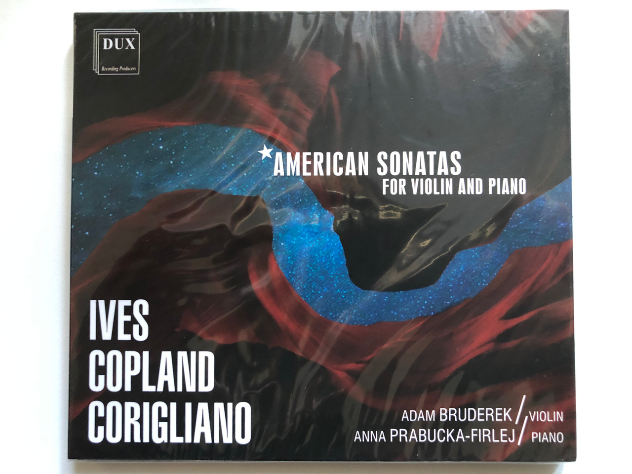 https://cdn10.bigcommerce.com/s-62bdpkt7pb/products/0/images/255029/American_Sonatas_For_Violin_And_Piano_-_Ives_Copland_Corigliano_Adam_Bruderek_violin_Anna_Prabucka-Firlej_piano_DUX_Recording_Audio_CD_2021_DUX_1744_1__71769.1664445287.1280.1280.JPG?c=2&_gl=1*17l3zfs*_ga*MjA2NTIxMjE2MC4xNTkwNTEyNTMy*_ga_WS2VZYPC6G*MTY2NDQzNTUwNy41NzMuMS4xNjY0NDQ1MTE5LjUxLjAuMA..
