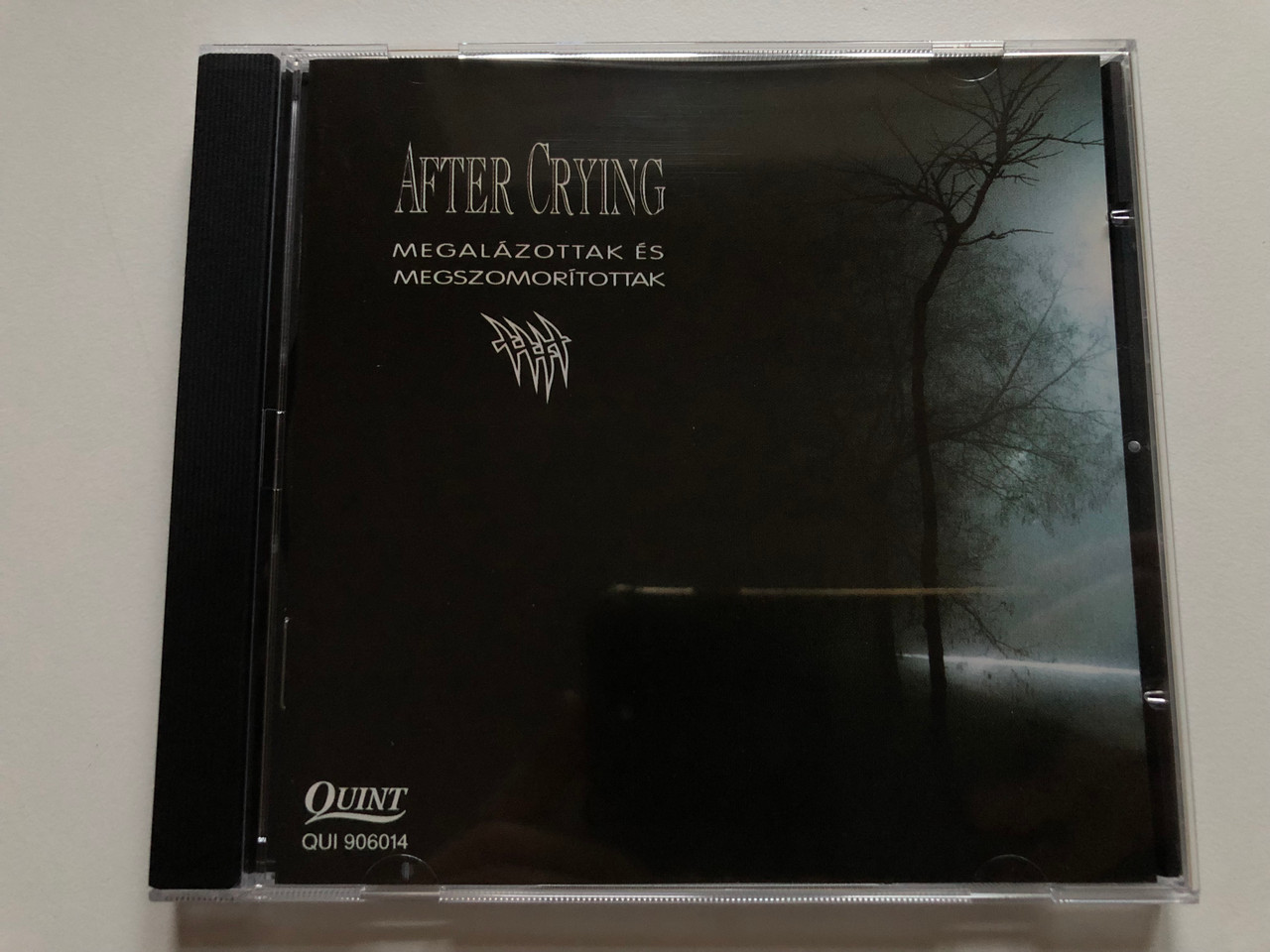 https://cdn10.bigcommerce.com/s-62bdpkt7pb/products/0/images/255316/After_Crying_Megalzottak_s_Megszomortottak_Quint_Audio_CD_1992_QUI_906014_1__91450.1664789213.1280.1280.JPG?c=2&_gl=1*1neakcc*_ga*MjA2NTIxMjE2MC4xNTkwNTEyNTMy*_ga_WS2VZYPC6G*MTY2NDc4ODA5My41NzkuMS4xNjY0Nzg4OTg3LjU4LjAuMA..