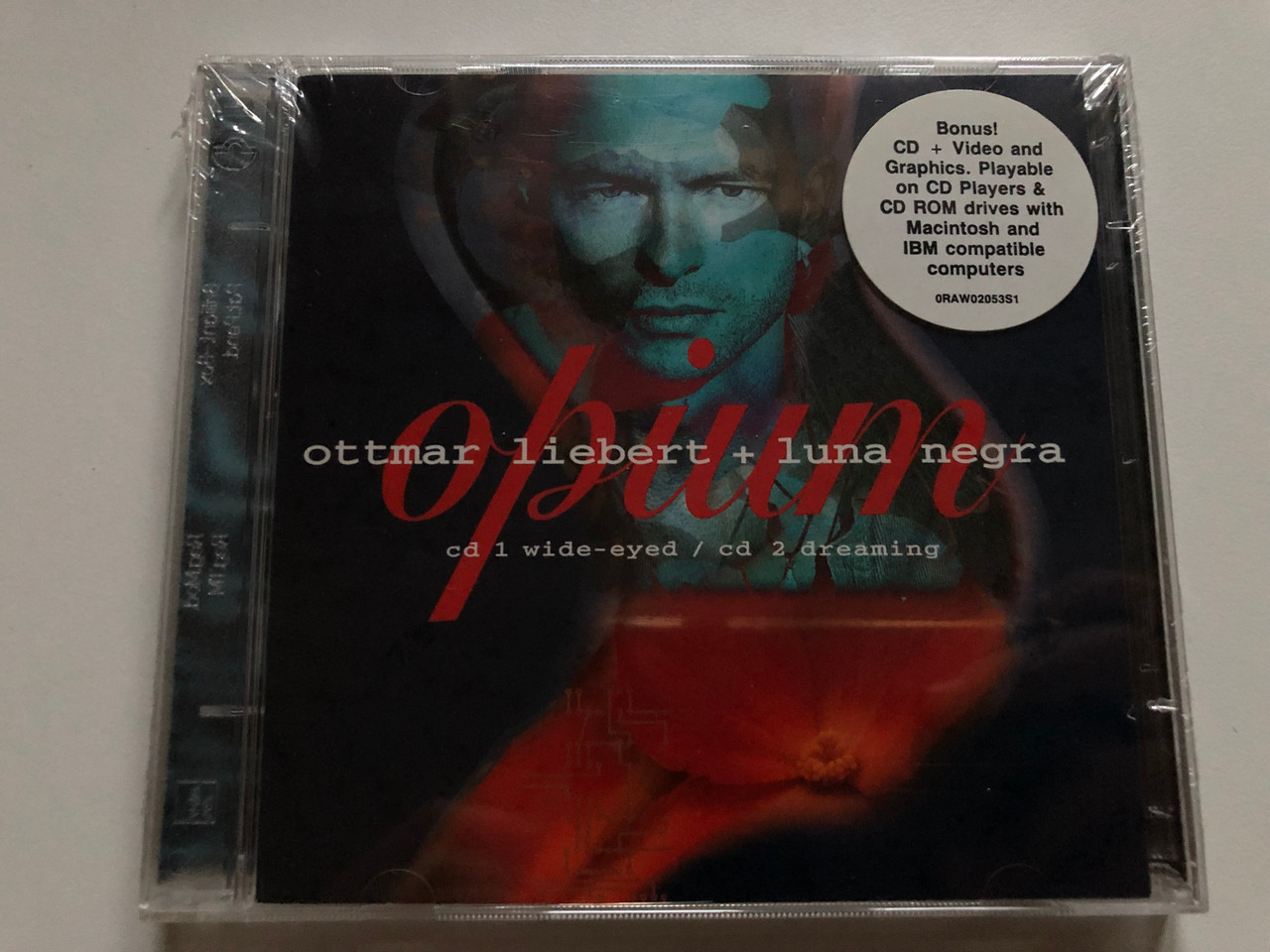 https://cdn10.bigcommerce.com/s-62bdpkt7pb/products/0/images/255363/Ottmar_Liebert_Luna_Negra_Opium_CD_1_Wide-eyed_CD_2_Dreaming_Bonus_CD_Video_and_Graphics._Playable_on_CD_Players_CD_ROM_drivers_with_Macinto_1__47828.1664793911.1280.1280.JPG?c=2&_gl=1*sg502w*_ga*MjA2NTIxMjE2MC4xNTkwNTEyNTMy*_ga_WS2VZYPC6G*MTY2NDc4ODA5My41NzkuMS4xNjY0NzkzNjM0LjUzLjAuMA..