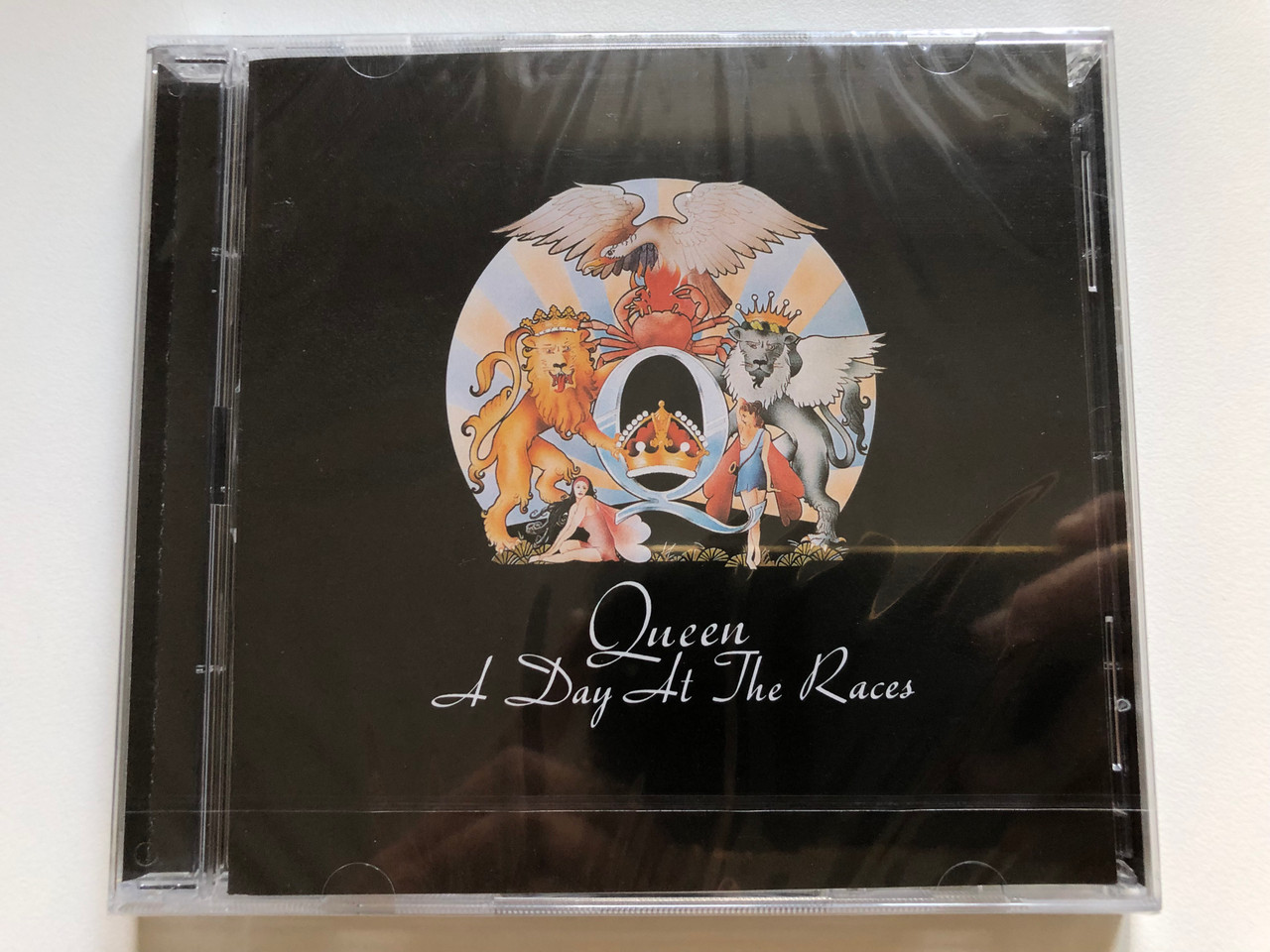 https://cdn10.bigcommerce.com/s-62bdpkt7pb/products/0/images/255547/Queen_A_Day_At_The_Races_Island_Records_Audio_CD_2011_276_441_6_1__46883.1664954557.1280.1280.JPG?c=2&_gl=1*miltk9*_ga*MjA2NTIxMjE2MC4xNTkwNTEyNTMy*_ga_WS2VZYPC6G*MTY2NDk0NjMxNC41ODEuMS4xNjY0OTU0NDY3LjQ1LjAuMA..