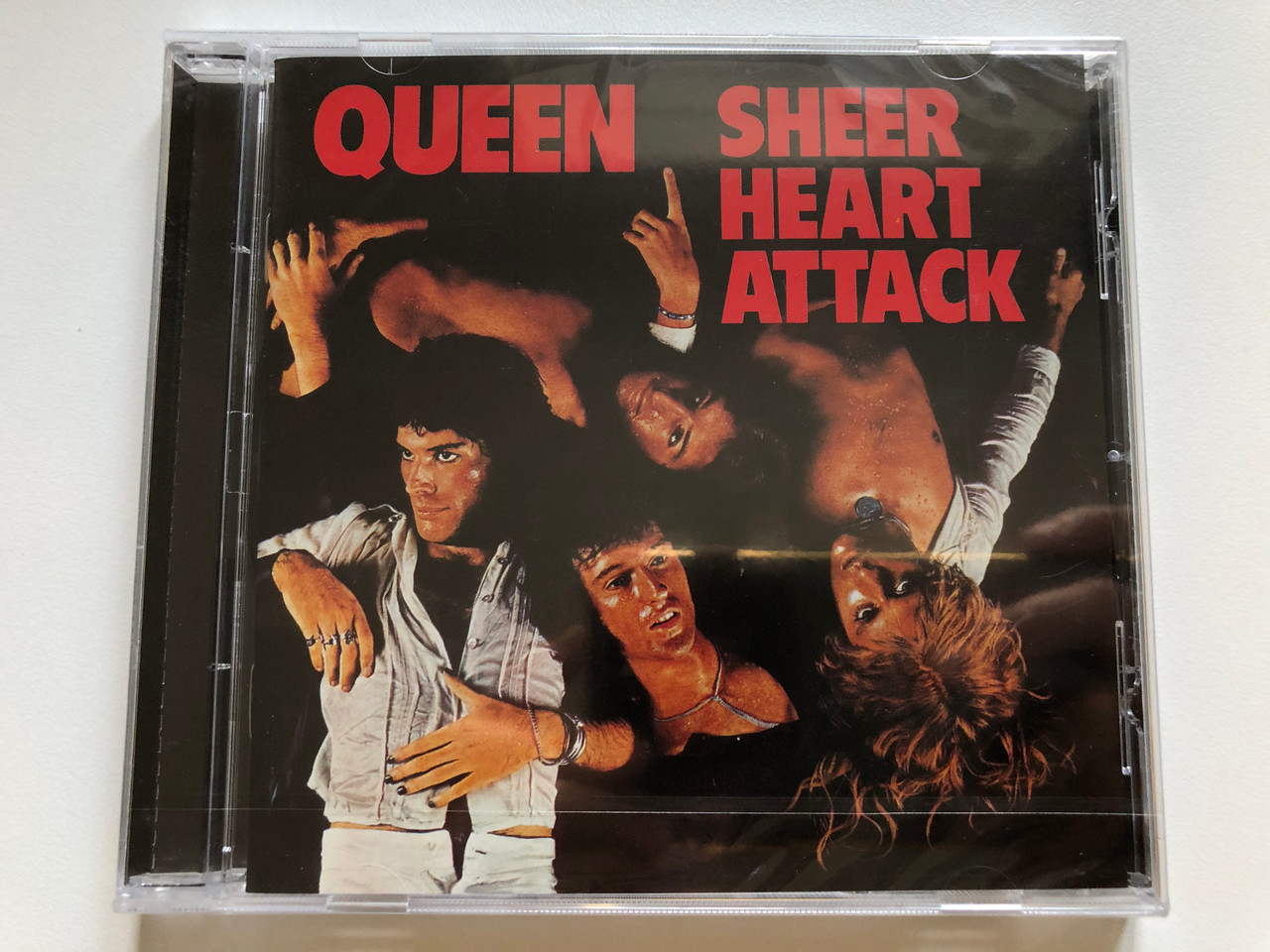 https://cdn10.bigcommerce.com/s-62bdpkt7pb/products/0/images/255568/Queen_Sheer_Heart_Attack_Virgin_EMI_Records_Audio_CD_2011_276_440_9_1__53071.1664967477.1280.1280.JPG?c=2&_gl=1*55v9zi*_ga*MjA2NTIxMjE2MC4xNTkwNTEyNTMy*_ga_WS2VZYPC6G*MTY2NDk2Njg0NS41ODMuMS4xNjY0OTY3Mzc1LjQyLjAuMA..