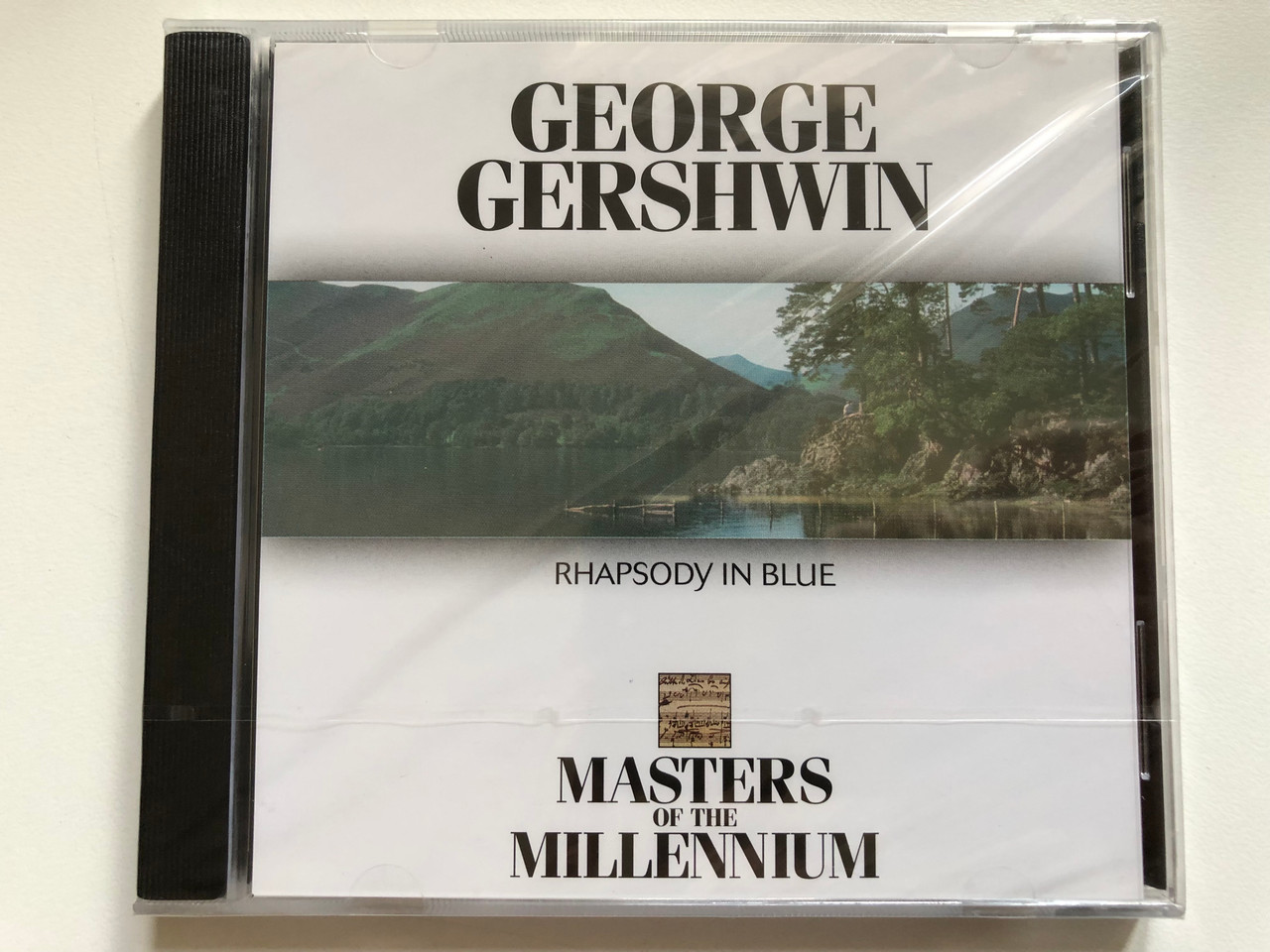 https://cdn10.bigcommerce.com/s-62bdpkt7pb/products/0/images/255606/George_Gershwin_Rhapsody_In_Blue_Masters_Of_The_Millennium_Audio_CD_1999_MM_2023_1__04039.1665034596.1280.1280.JPG?c=2&_gl=1*5tm68c*_ga*MjA2NTIxMjE2MC4xNTkwNTEyNTMy*_ga_WS2VZYPC6G*MTY2NTAyOTk3MC41ODQuMS4xNjY1MDM0NTEwLjUxLjAuMA..