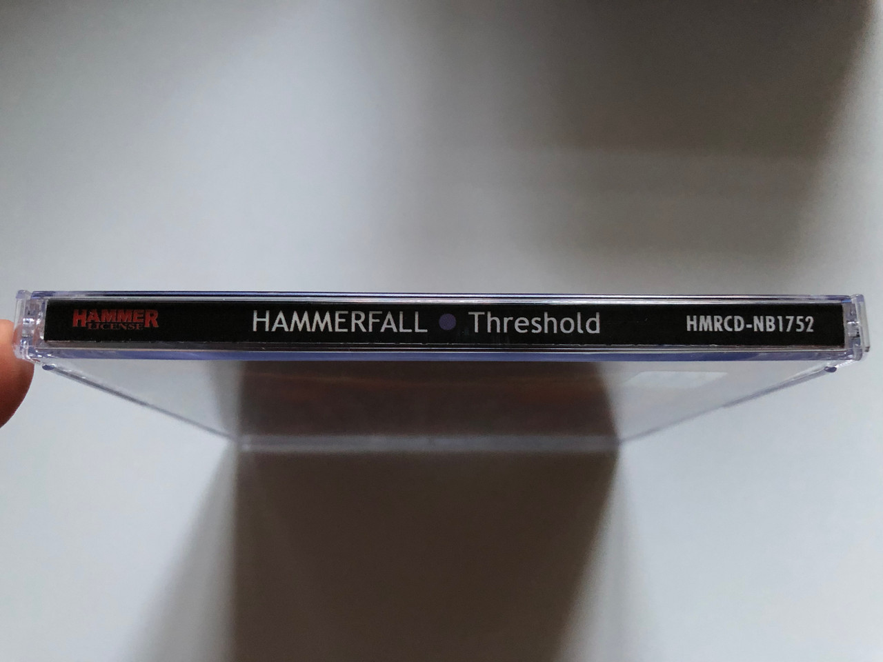 https://cdn10.bigcommerce.com/s-62bdpkt7pb/products/0/images/255668/HammerFall_Threshold_Hammer_License_Audio_CD_2006_HMRCD-NB1752_3__75306.1665052679.1280.1280.JPG?c=2&_gl=1*1x8lwgk*_ga*MjA2NTIxMjE2MC4xNTkwNTEyNTMy*_ga_WS2VZYPC6G*MTY2NTA0NDUxMS41ODUuMS4xNjY1MDUyNTU5LjUwLjAuMA..