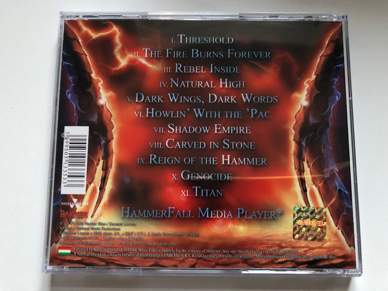 https://cdn10.bigcommerce.com/s-62bdpkt7pb/products/0/images/255670/HammerFall_Threshold_Hammer_License_Audio_CD_2006_HMRCD-NB1752_2__47509.1665052685.1280.1280.JPG?c=2&_gl=1*1x8lwgk*_ga*MjA2NTIxMjE2MC4xNTkwNTEyNTMy*_ga_WS2VZYPC6G*MTY2NTA0NDUxMS41ODUuMS4xNjY1MDUyNTU5LjUwLjAuMA..