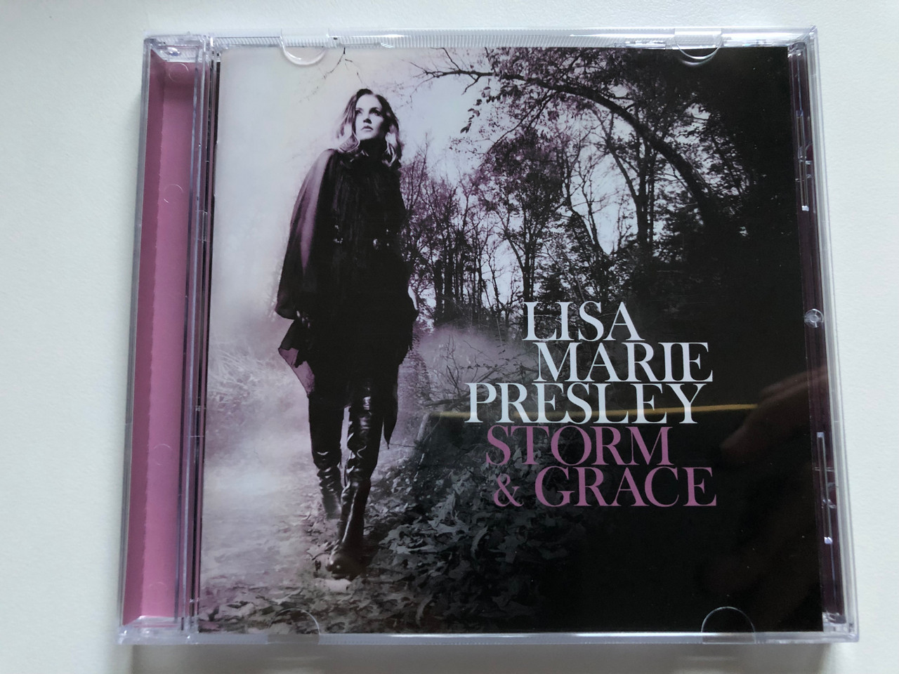 https://cdn10.bigcommerce.com/s-62bdpkt7pb/products/0/images/255691/Lisa_Marie_Presley_Storm_Grace_XIX_Recordings_Audio_CD_2012_602537019694_1__00440.1665121105.1280.1280.JPG?c=2&_gl=1*1j04w42*_ga*MjA2NTIxMjE2MC4xNTkwNTEyNTMy*_ga_WS2VZYPC6G*MTY2NTEyMDY0My41ODYuMS4xNjY1MTIwOTc4LjMyLjAuMA..