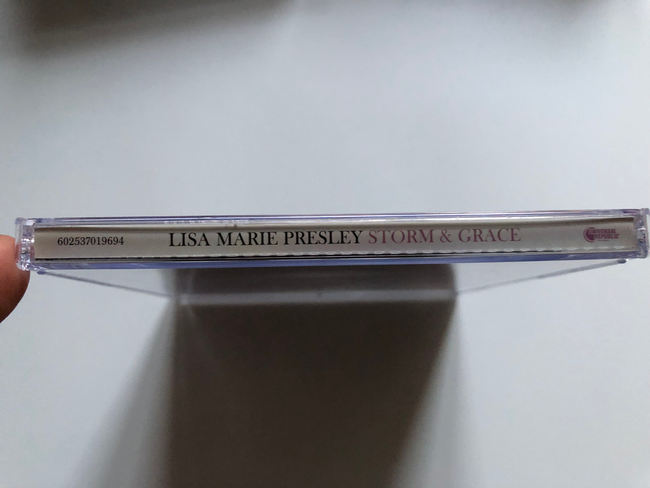https://cdn10.bigcommerce.com/s-62bdpkt7pb/products/0/images/255693/Lisa_Marie_Presley_Storm_Grace_XIX_Recordings_Audio_CD_2012_602537019694_3__12162.1665121133.1280.1280.JPG?c=2&_gl=1*1bzs43p*_ga*MjA2NTIxMjE2MC4xNTkwNTEyNTMy*_ga_WS2VZYPC6G*MTY2NTEyMDY0My41ODYuMS4xNjY1MTIwOTc4LjMyLjAuMA..