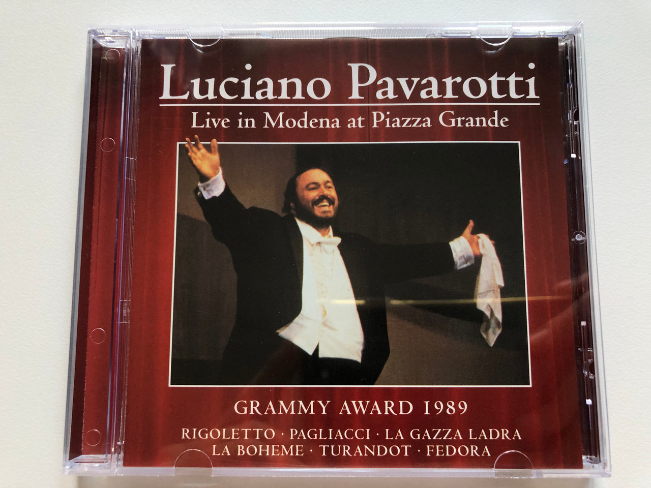 https://cdn10.bigcommerce.com/s-62bdpkt7pb/products/0/images/255755/Luciano_Pavarotti_-_Live_In_Moderna_at_Piazza_Grande_Grammy_Award_1989_Rigoletto_Pagliacci_La_Gazza_Ladra_La_Boheme_Turandot_Fedora_Eurotrend_Audio_CD_2003_142_1__60652.1665134583.1280.1280.JPG?c=2&_gl=1*1dqxqxo*_ga*MjA2NTIxMjE2MC4xNTkwNTEyNTMy*_ga_WS2VZYPC6G*MTY2NTEyMDY0My41ODYuMS4xNjY1MTM0MzcwLjU5LjAuMA..