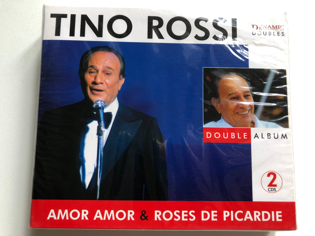 https://cdn10.bigcommerce.com/s-62bdpkt7pb/products/0/images/255937/Tino_Rossi_-_Amor_Amor_Roses_De_Picardie_Double_Album_Dynamic_Entertainment_Ltd_2x_Audio_CD_2005_DYN_4034_1__78722.1665504551.1280.1280.JPG?c=2&_gl=1*1v8qt1l*_ga*MjA2NTIxMjE2MC4xNTkwNTEyNTMy*_ga_WS2VZYPC6G*MTY2NTQ5NDYwOS41ODkuMS4xNjY1NTA0NDU1LjYwLjAuMA..