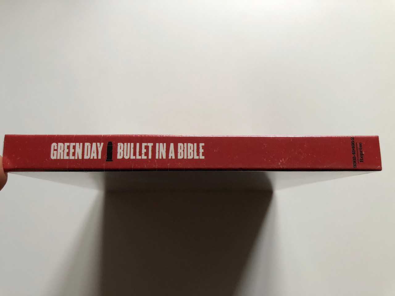 https://cdn10.bigcommerce.com/s-62bdpkt7pb/products/0/images/256069/Green_Day_Bullet_In_A_Bible_Their_first_ever_Live_CD_and_DVD_takes_you_on-stage_behind_the_scenes_includes_in-depth_interviews_of_the_American_Idiot_tour_Reprise_Records_Audio_CD_D_3__41645.1665593664.1280.1280.JPG?c=2&_gl=1*cli8dr*_ga*MjA2NTIxMjE2MC4xNTkwNTEyNTMy*_ga_WS2VZYPC6G*MTY2NTU4NTUzOC41OTAuMS4xNjY1NTkzNDIyLjU4LjAuMA..