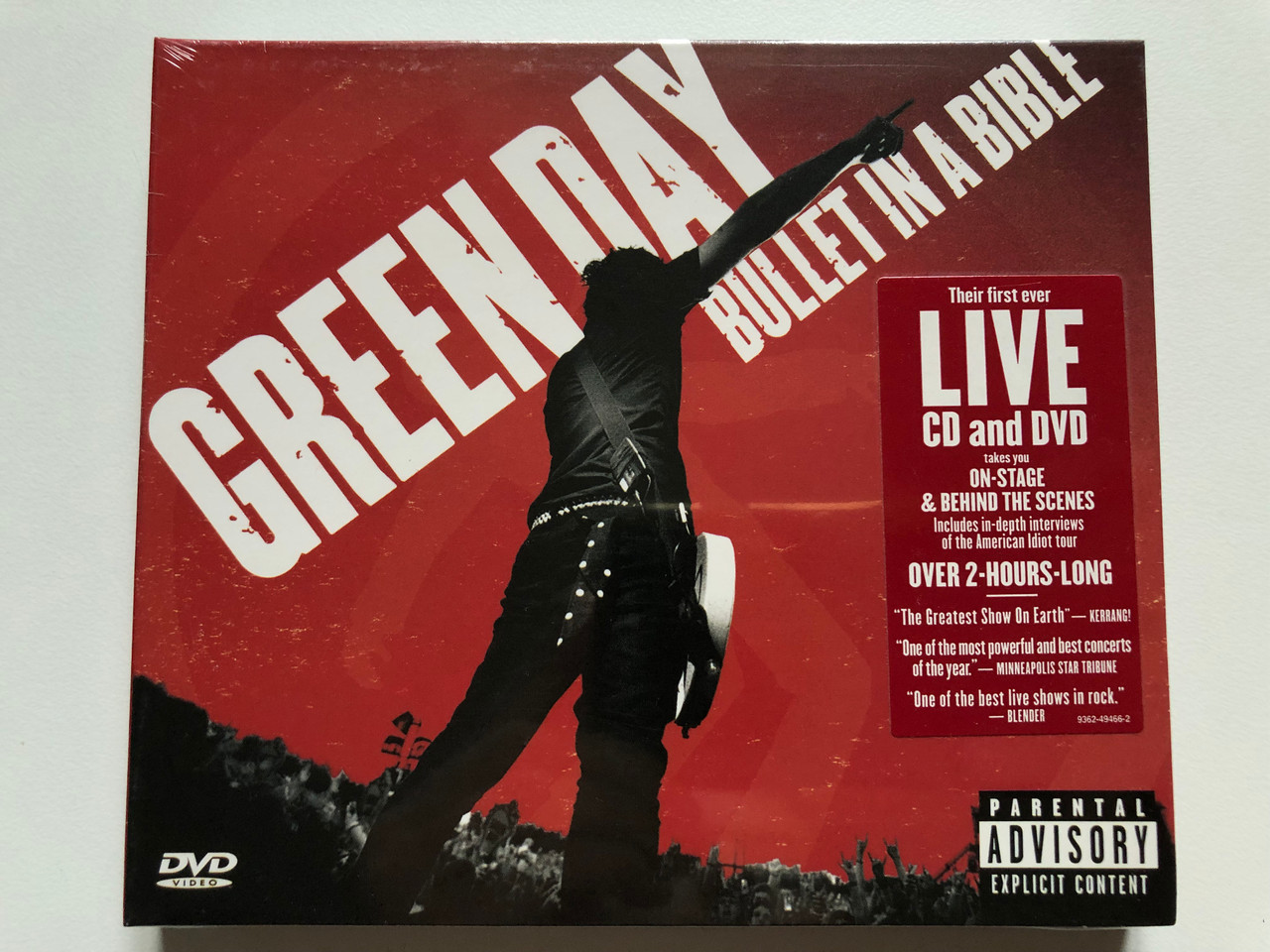 https://cdn10.bigcommerce.com/s-62bdpkt7pb/products/0/images/256071/Green_Day_Bullet_In_A_Bible_Their_first_ever_Live_CD_and_DVD_takes_you_on-stage_behind_the_scenes_includes_in-depth_interviews_of_the_American_Idiot_tour_Reprise_Records_Audio_CD_DVD_1__29902.1665593686.1280.1280.JPG?c=2&_gl=1*cli8dr*_ga*MjA2NTIxMjE2MC4xNTkwNTEyNTMy*_ga_WS2VZYPC6G*MTY2NTU4NTUzOC41OTAuMS4xNjY1NTkzNDIyLjU4LjAuMA..